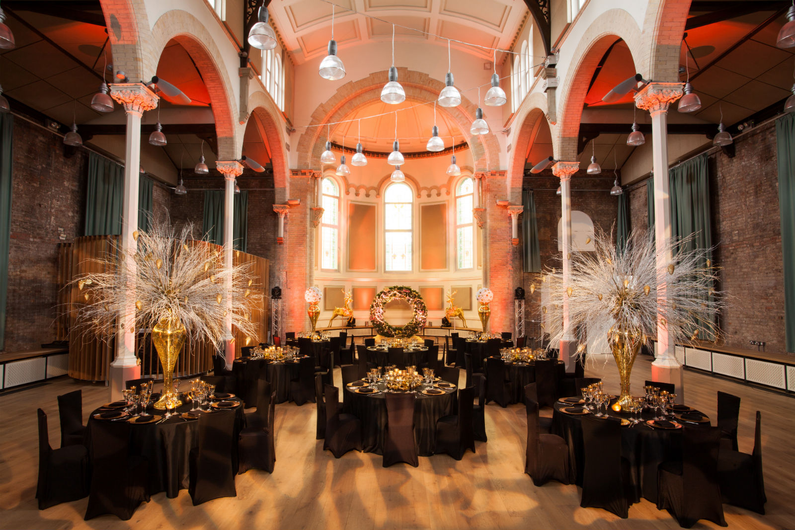 Elegant event space at Hallé St Peter's with round tables for upscale gatherings.