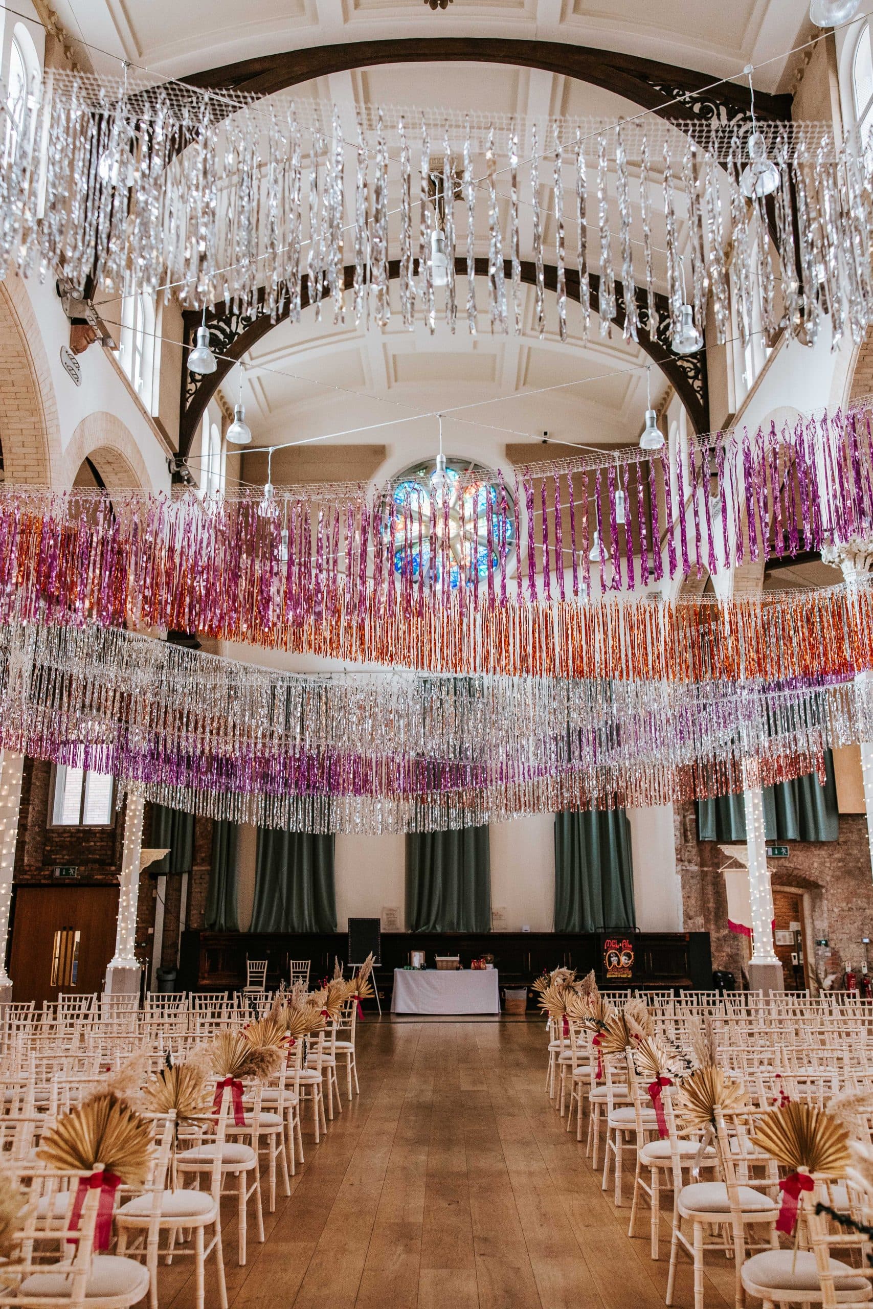 Metallic fringe ceiling installation at Hallé St Peter's, festive event venue hire.