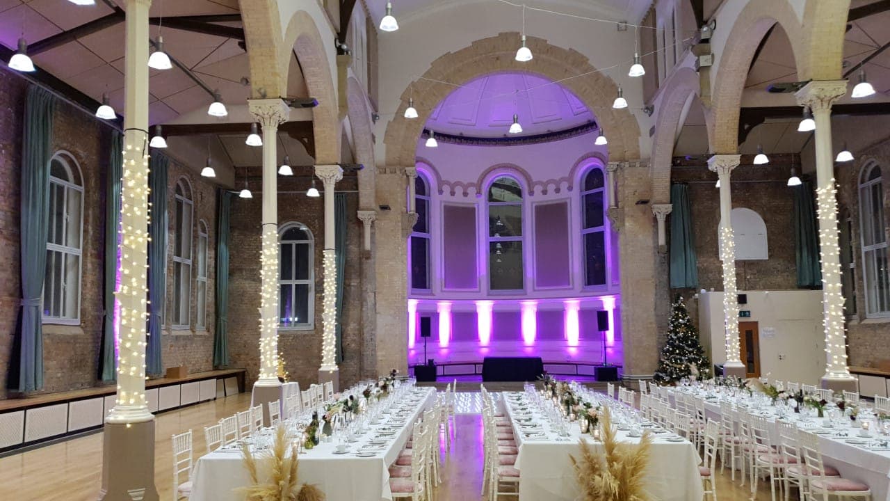 Hallé St Peter's banquet hall with stone arches, ideal for gala dinners and corporate events.