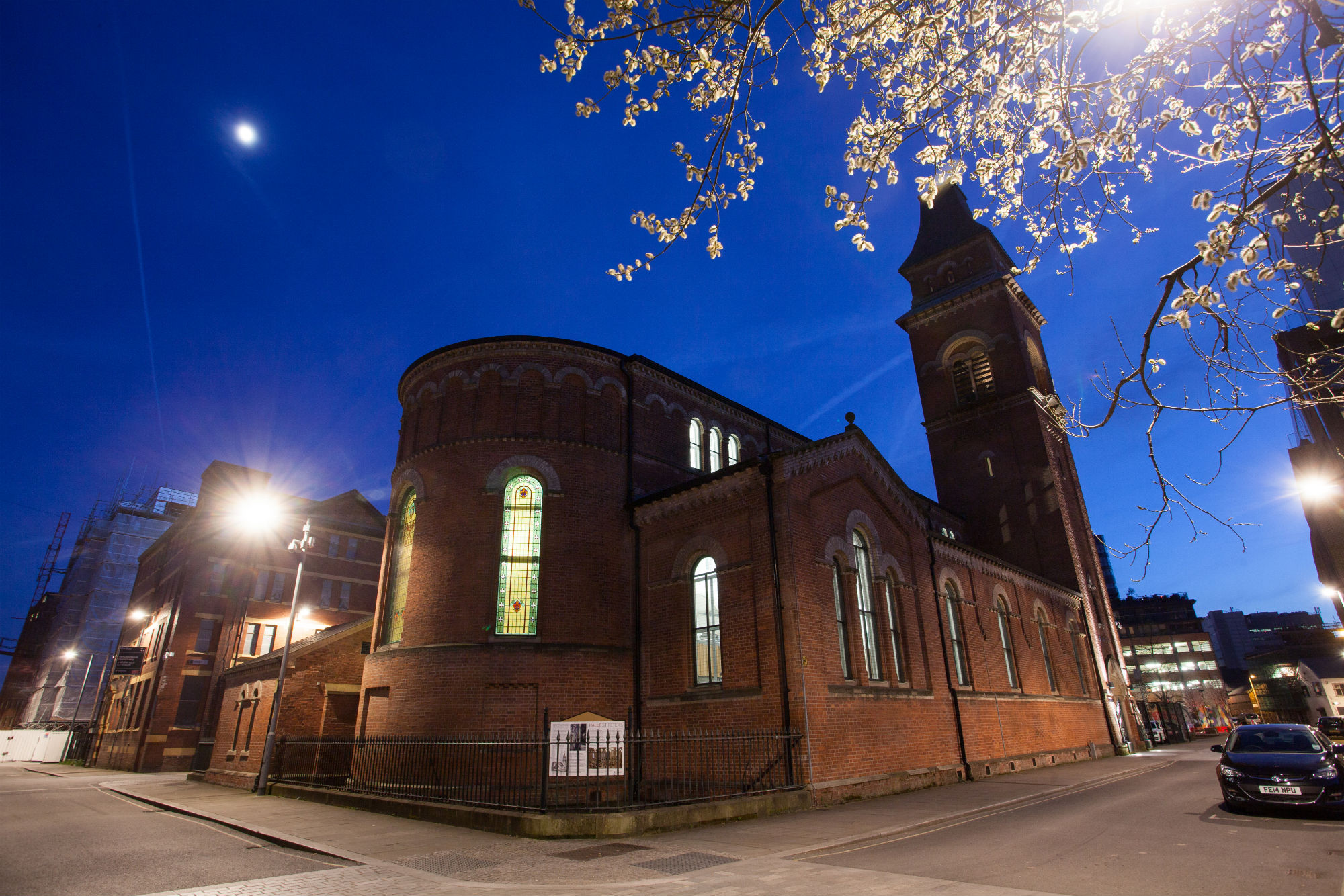 Historic Hallé St Peter's venue illuminated at dusk, perfect for evening events and receptions.