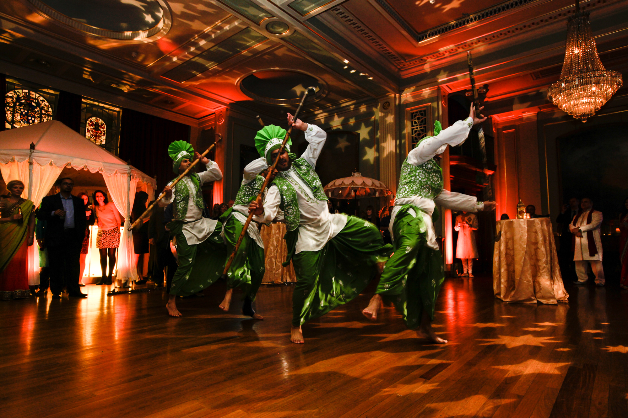 Vibrant cultural performance with dancers in traditional attire at Livery Hall event.