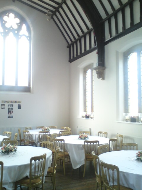 Private Chapel in The Monastery Manchester, spacious venue with elegant round tables for events.