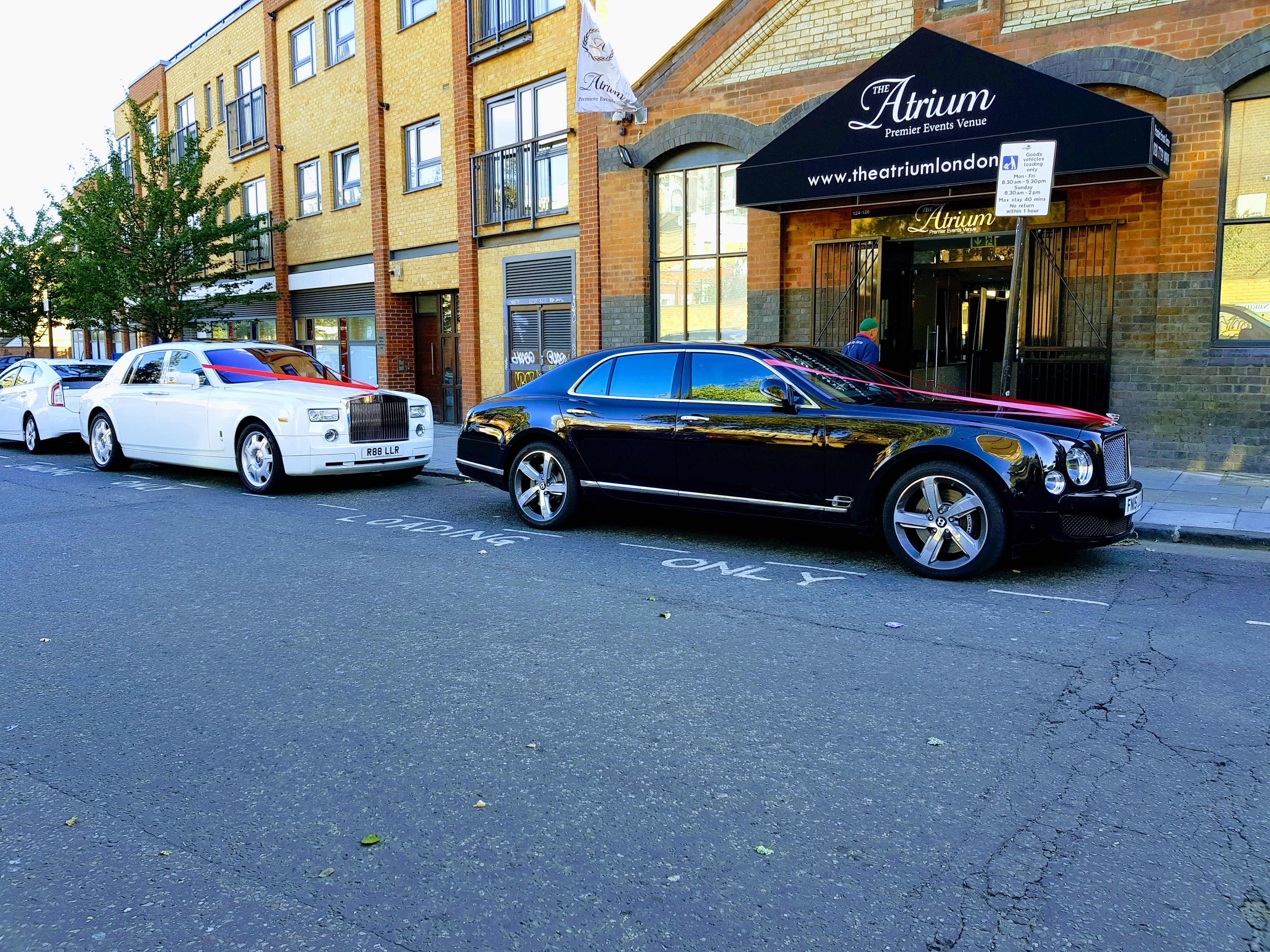 Main Hall in The Atrium London with luxury cars for upscale corporate events.