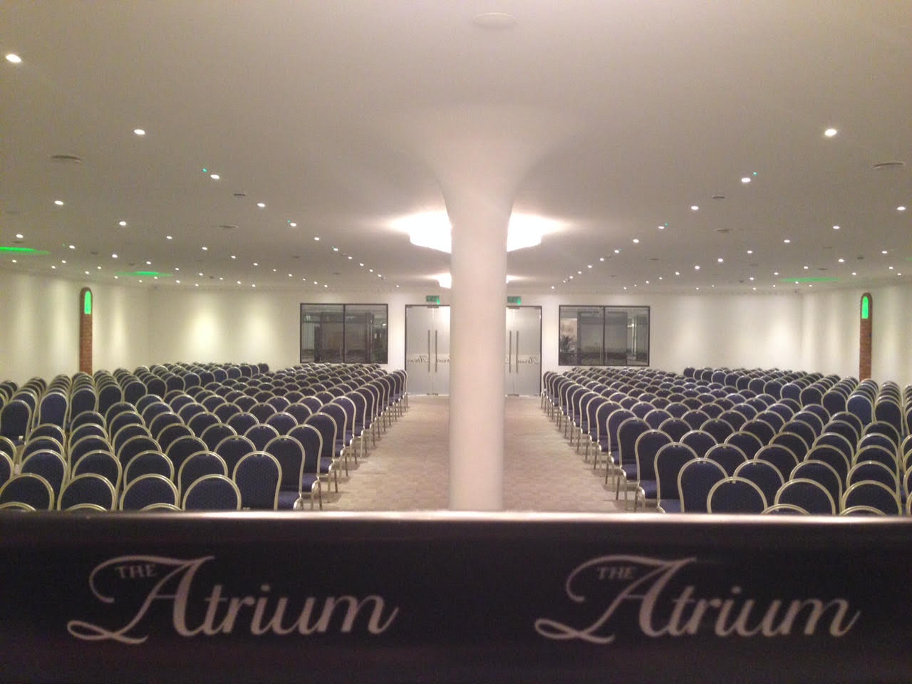 Main Hall in The Atrium London, spacious venue with blue chairs for conferences.