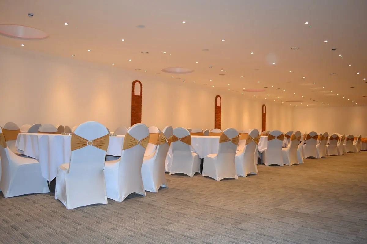 Main Hall in The Atrium London, elegant tables set for formal events like weddings and banquets.