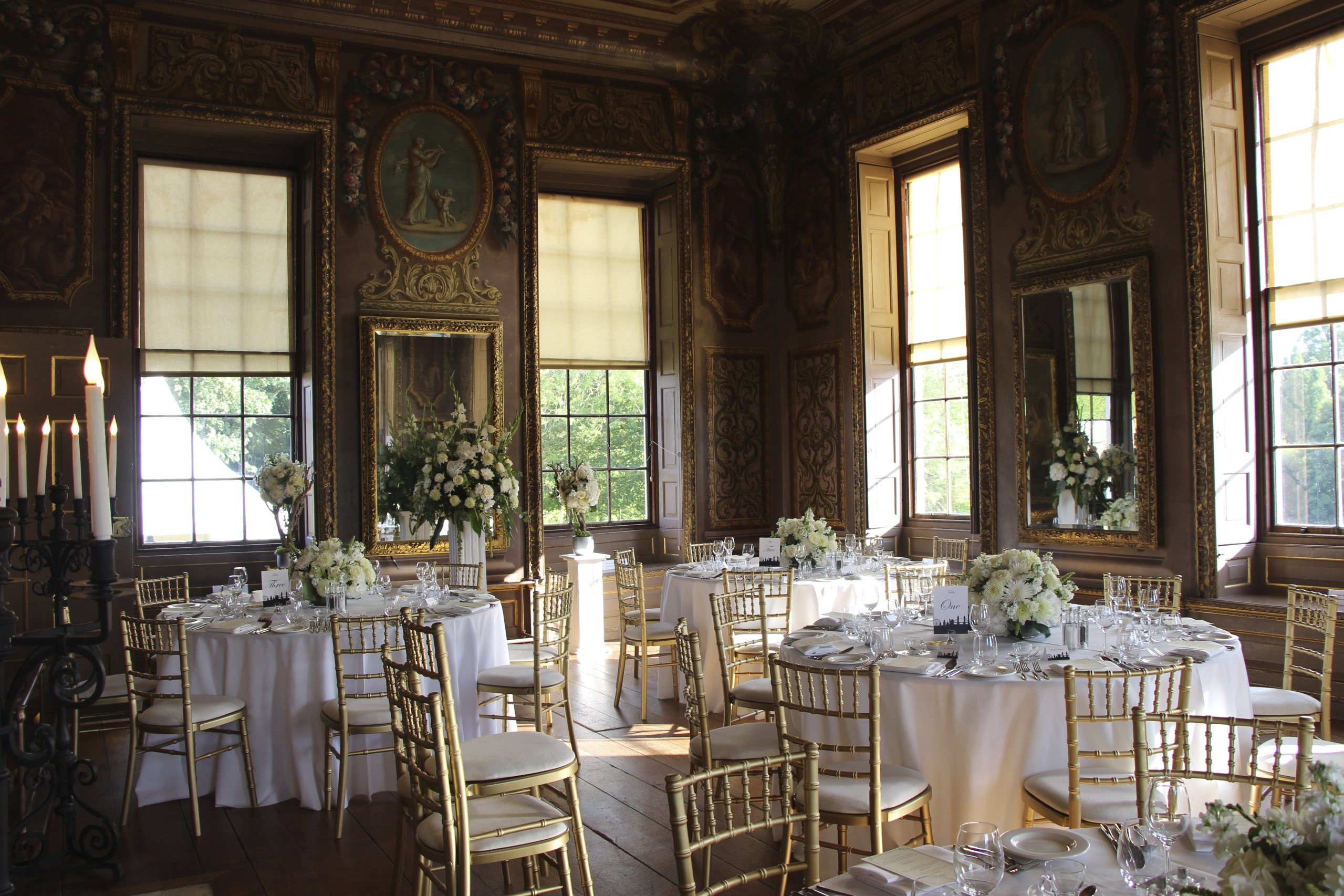 Elegant Little Banqueting House with floral centerpieces, ideal for upscale weddings.