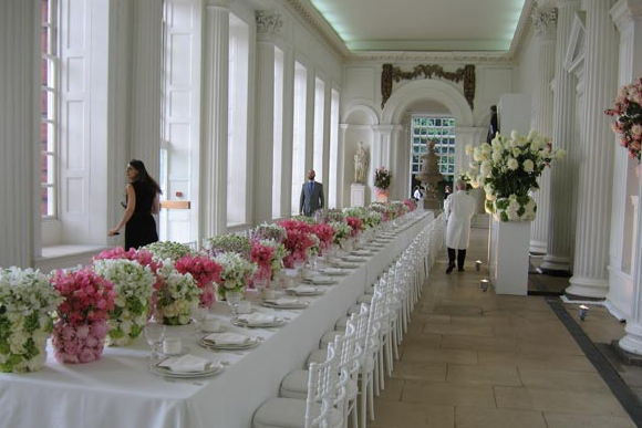 Elegant long table with floral centerpieces in The Orangery, Kensington Palace for weddings.