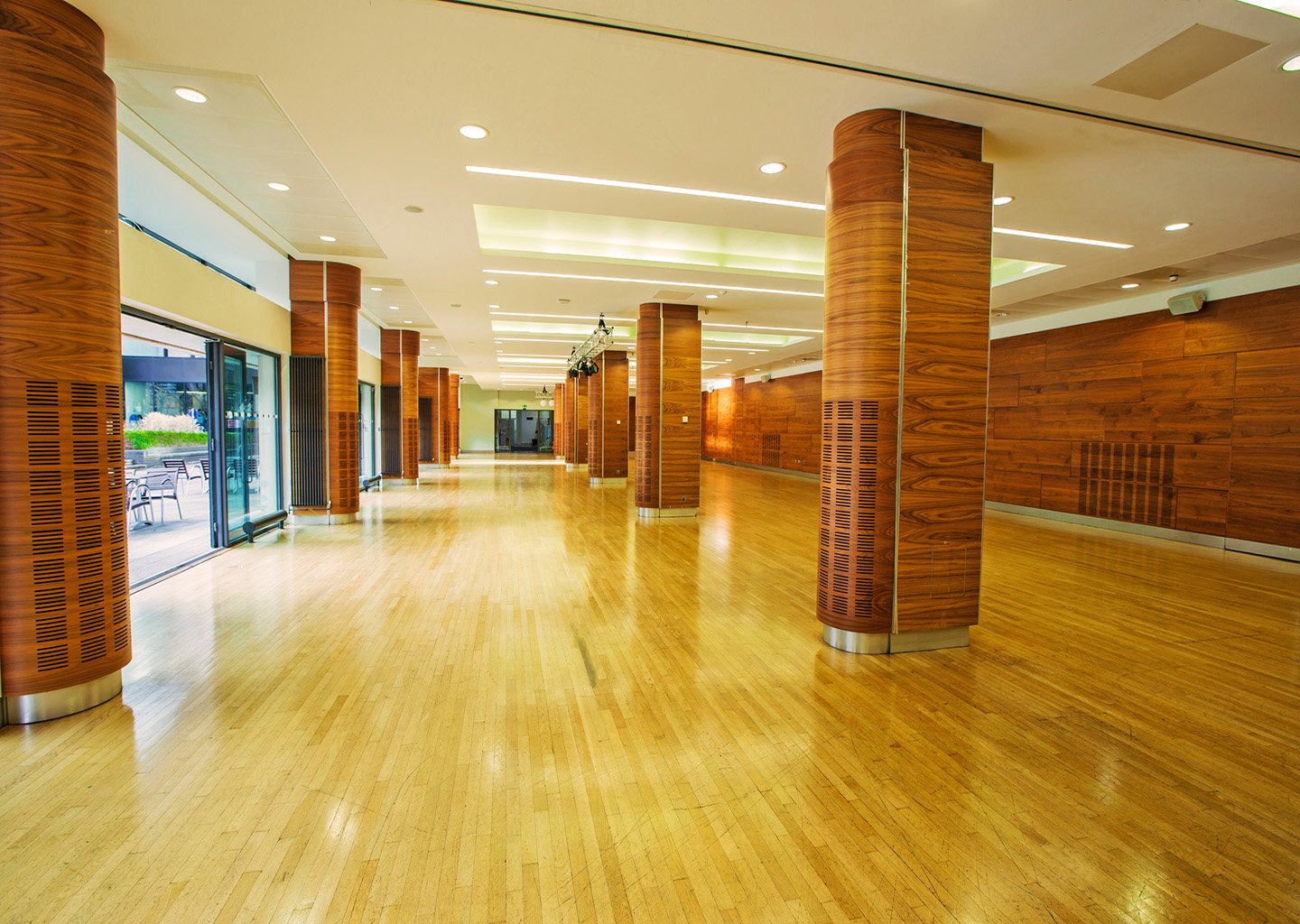 Queen's Tower Rooms at Imperial College, spacious event space with polished wooden floors.