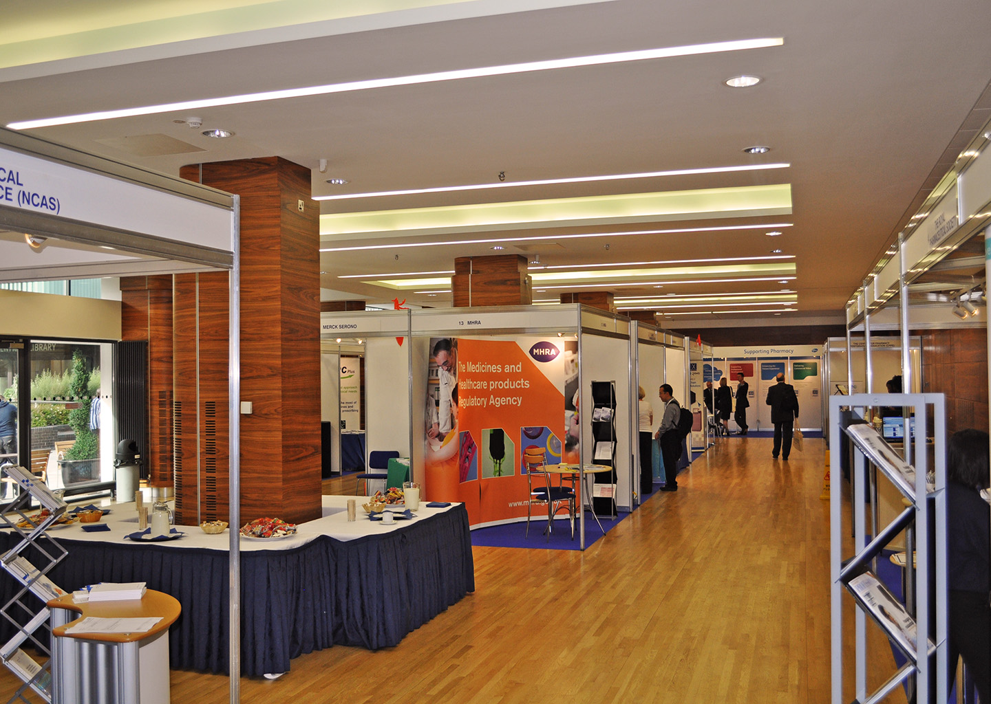 Queen's Tower Rooms exhibition space with booths, ideal for networking events and meetings.