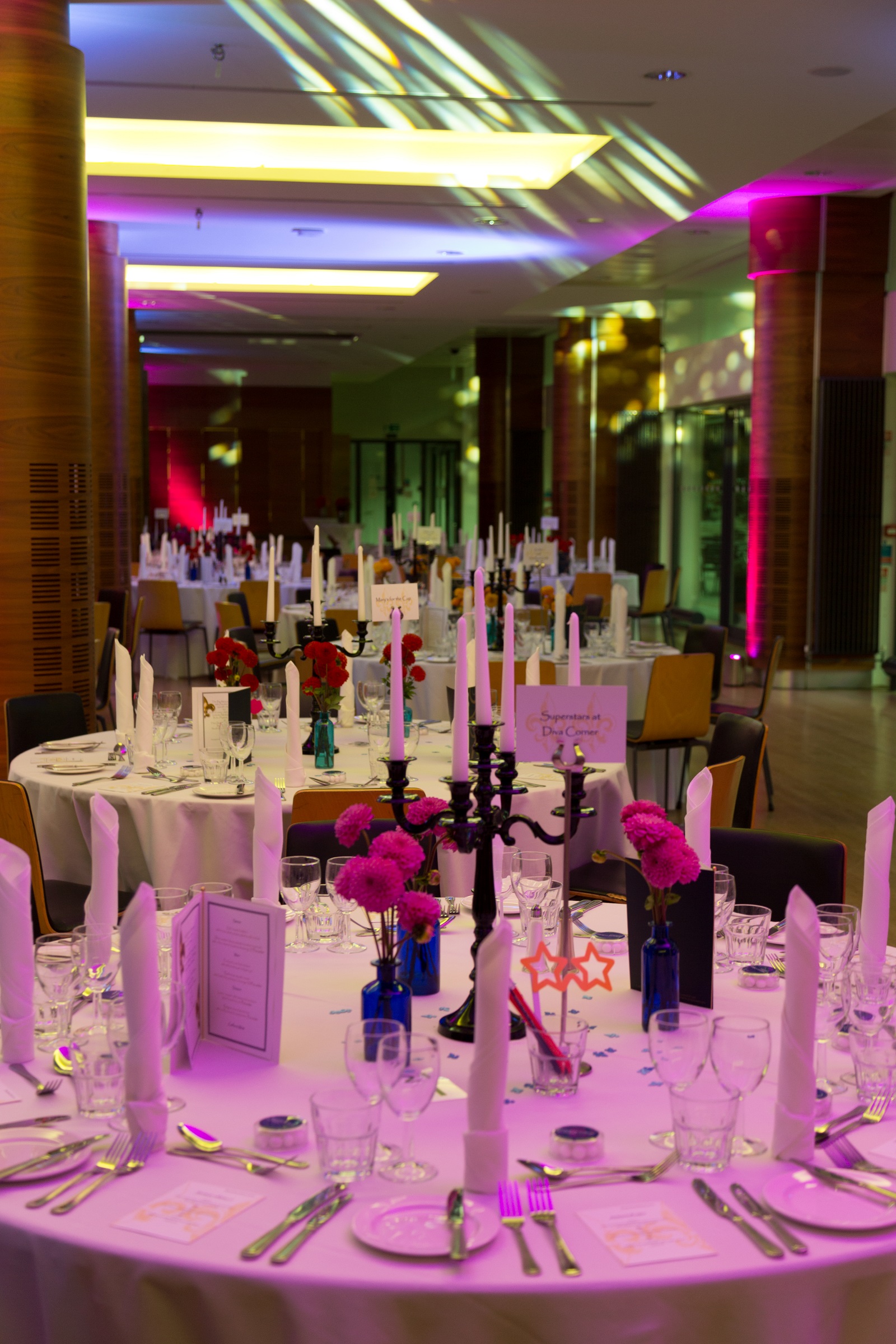 Elegant dining setup with floral centerpieces for gala dinners at Queen's Tower Rooms.