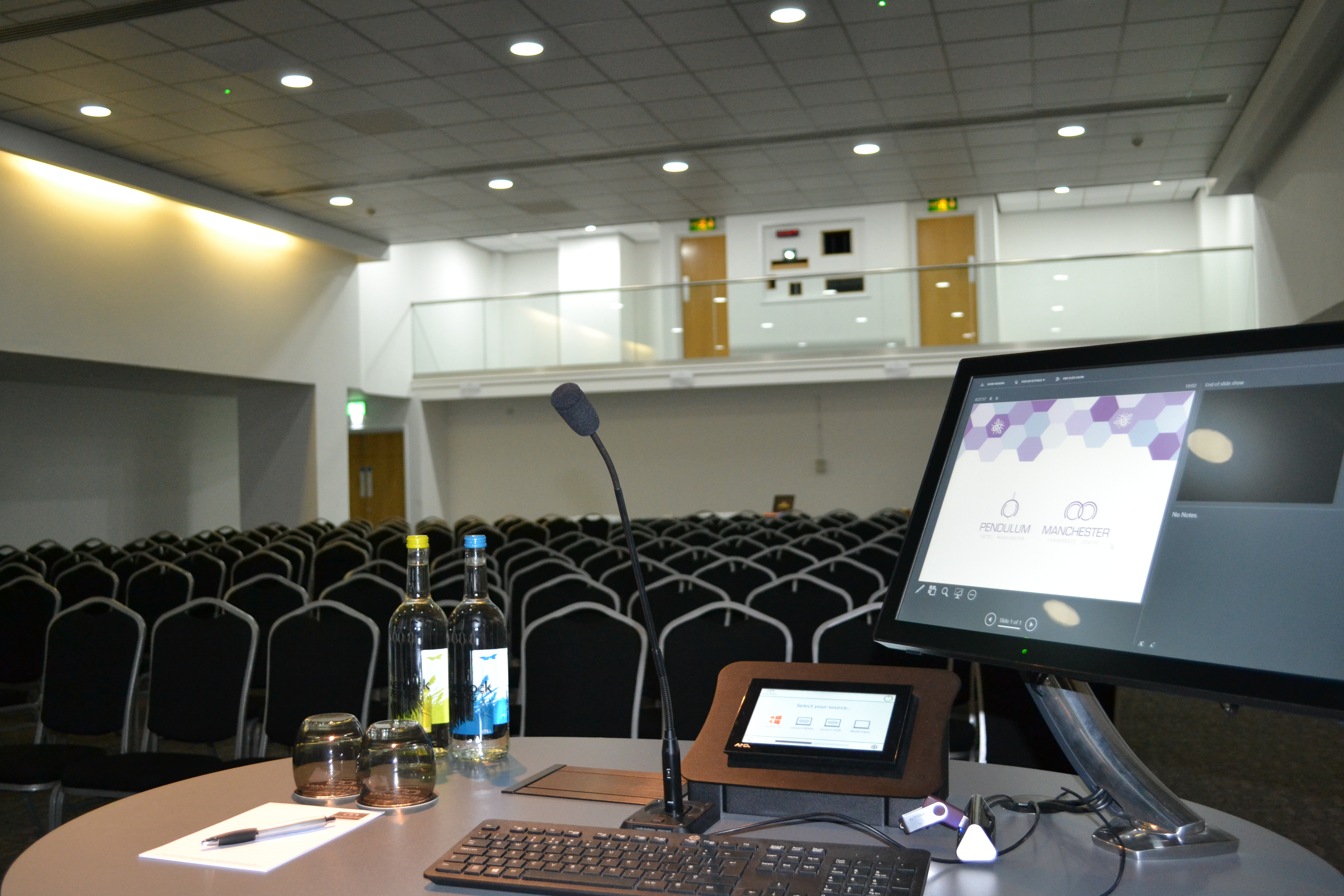 Pendulum Suite conference room with podium, ideal for corporate events and seminars.