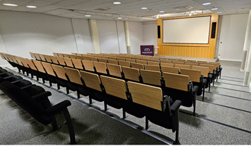 Cotton Theatre auditorium with tiered seating for corporate events and lectures.