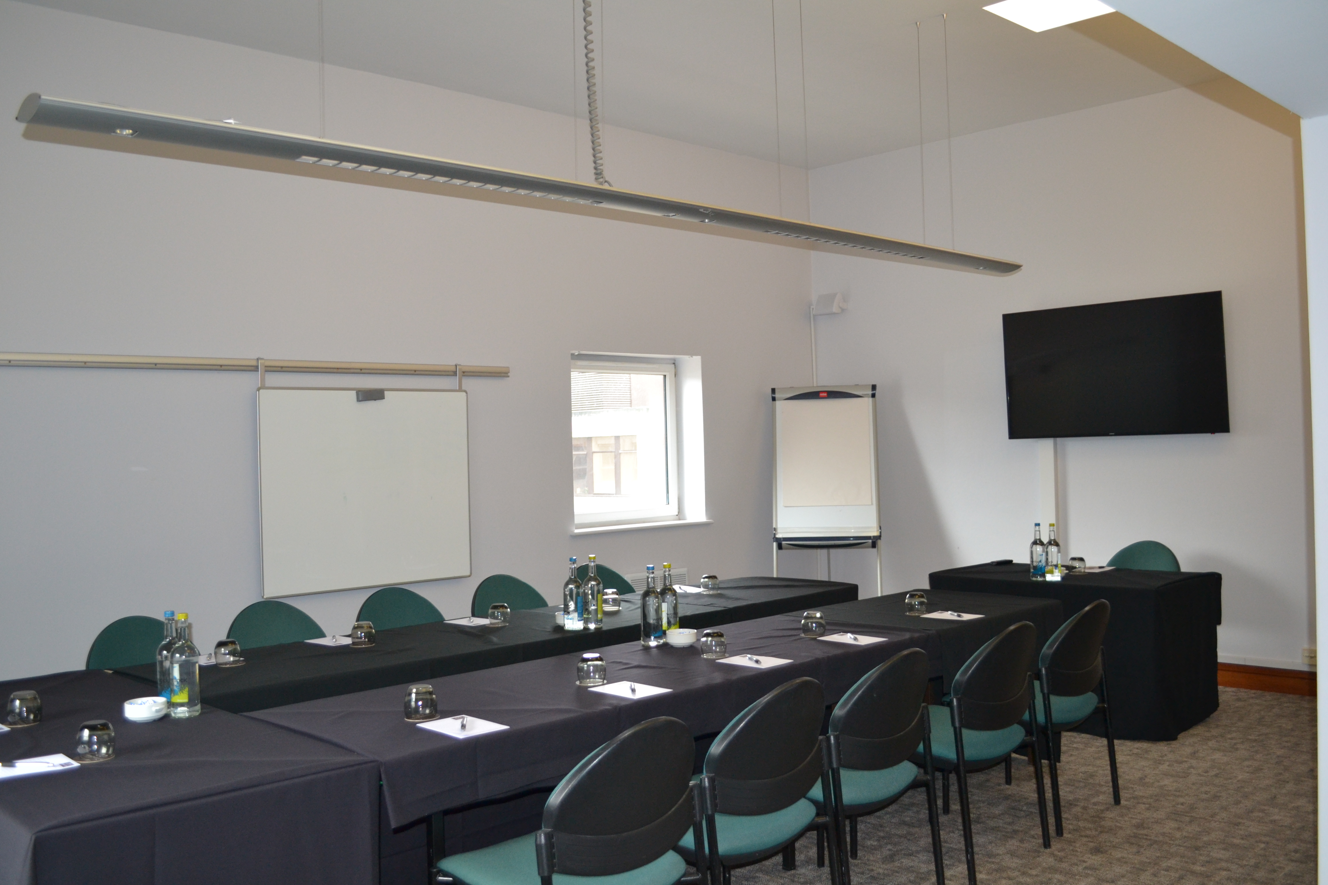 Adamson Suite meeting room with long table, ideal for conferences and presentations.