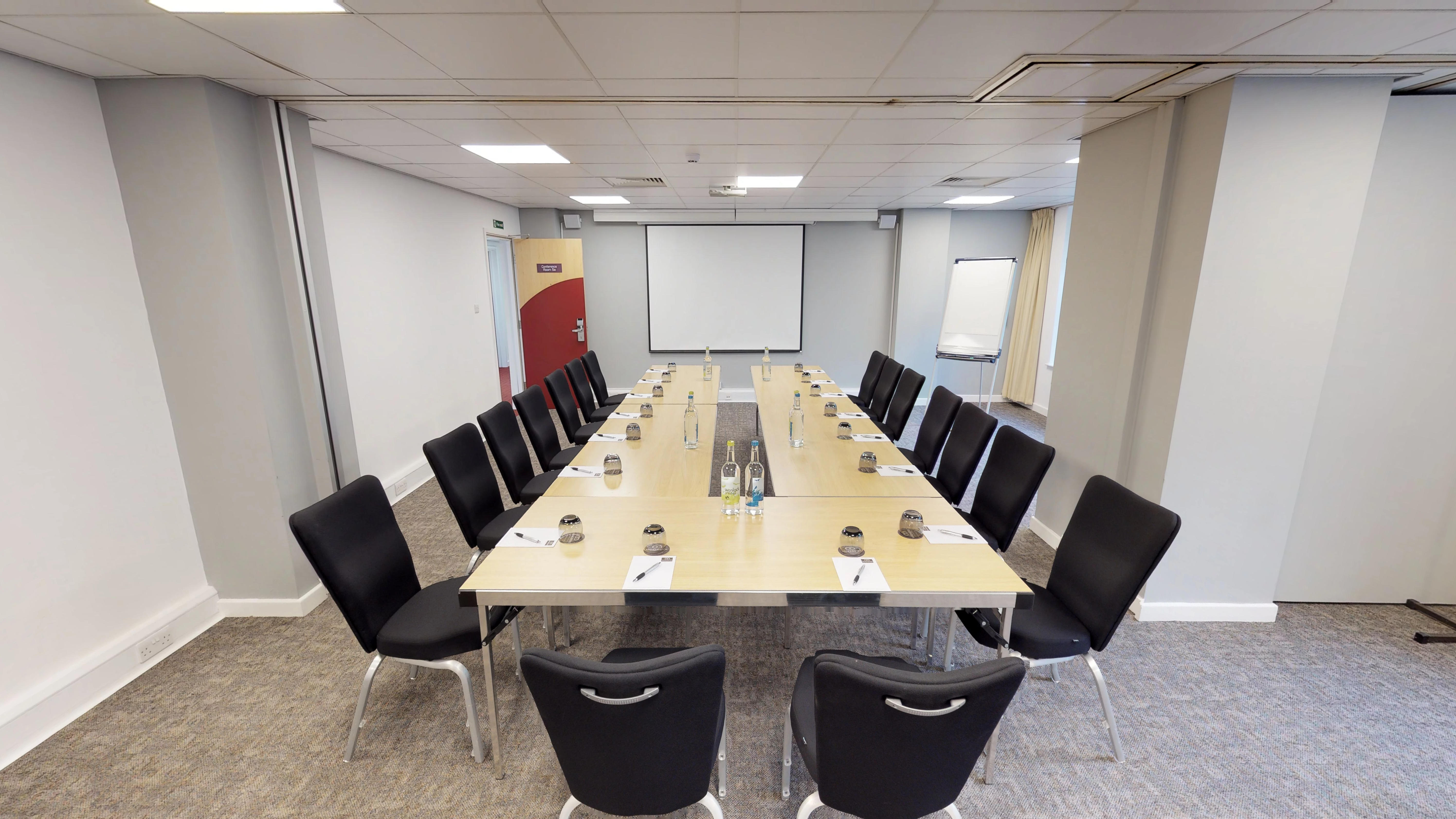 Meeting room in Manchester Conference Centre, set up for professional gatherings and presentations.