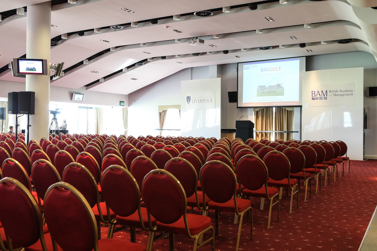 Sunloch Suite conference room with red chairs, ideal for corporate events and seminars.