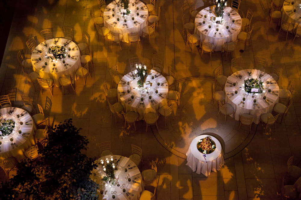 Elegant event space with round tables, ideal for weddings and corporate gatherings.