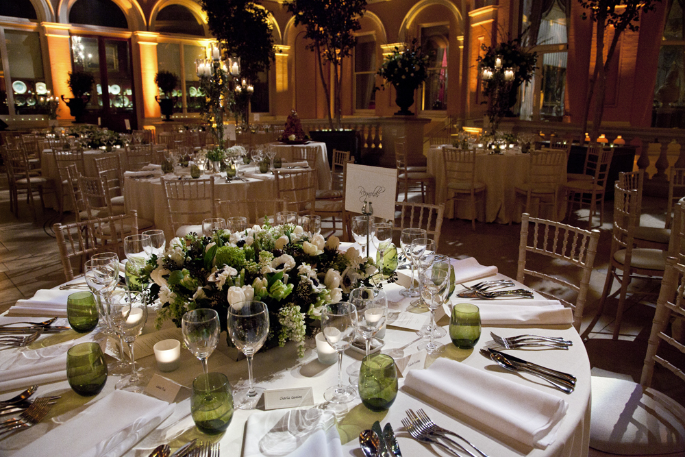 Elegant banquet hall with floral centerpieces for weddings and corporate events.