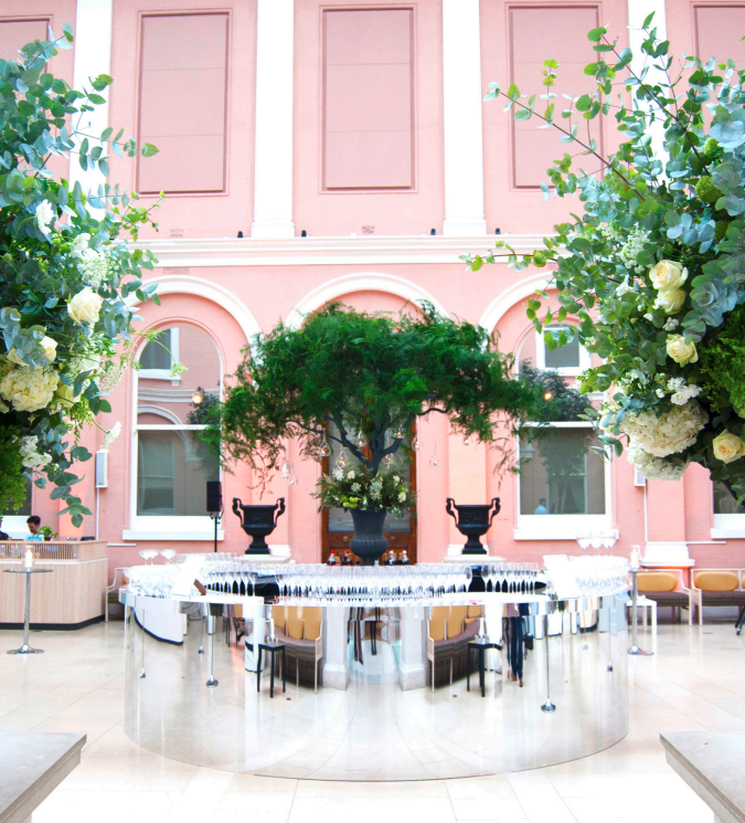 Elegant event space with floral arrangements at The Courtyard, ideal for upscale gatherings.