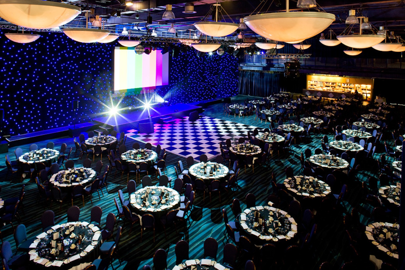 Premier Suite banquet hall at Bolton Whites Hotel, elegant tables for corporate events.