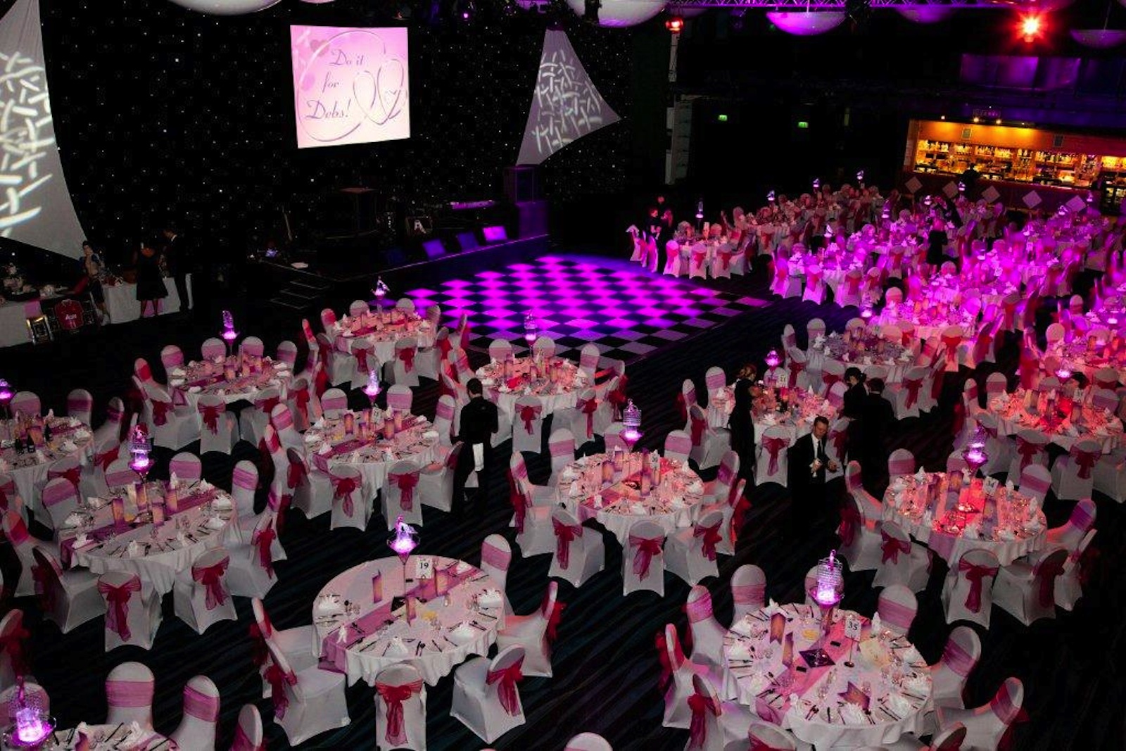 Premier Suite at Bolton Whites Hotel, elegant gala setup with pink sashes, corporate events.