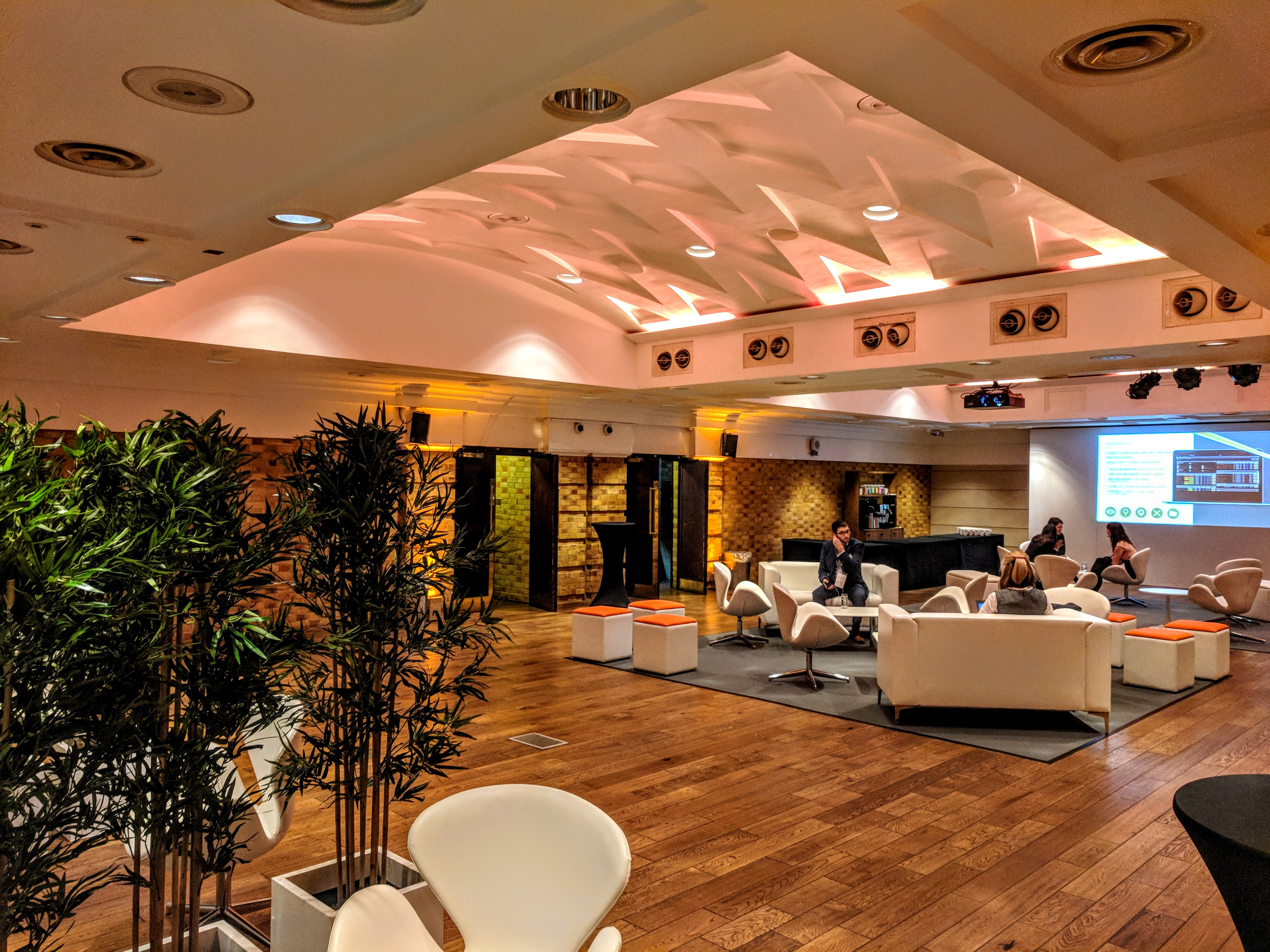 Modern event space at The Queen Charlotte, warm lighting, ideal for networking and meetings.