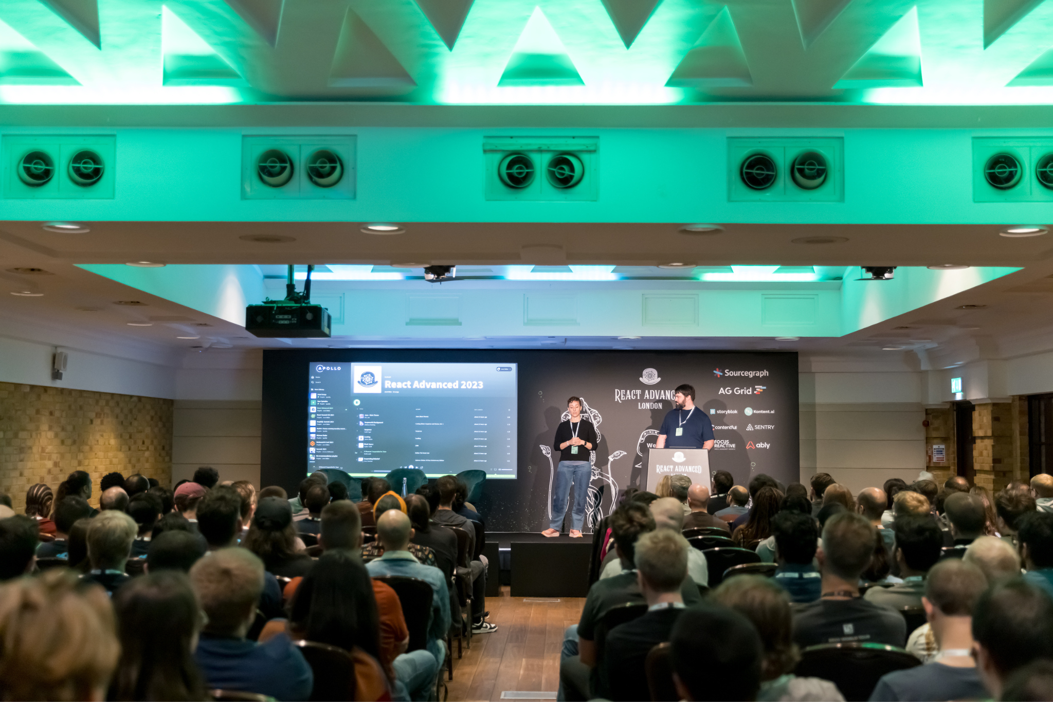 Conference session at The Queen Charlotte with engaging speaker and audience participation.