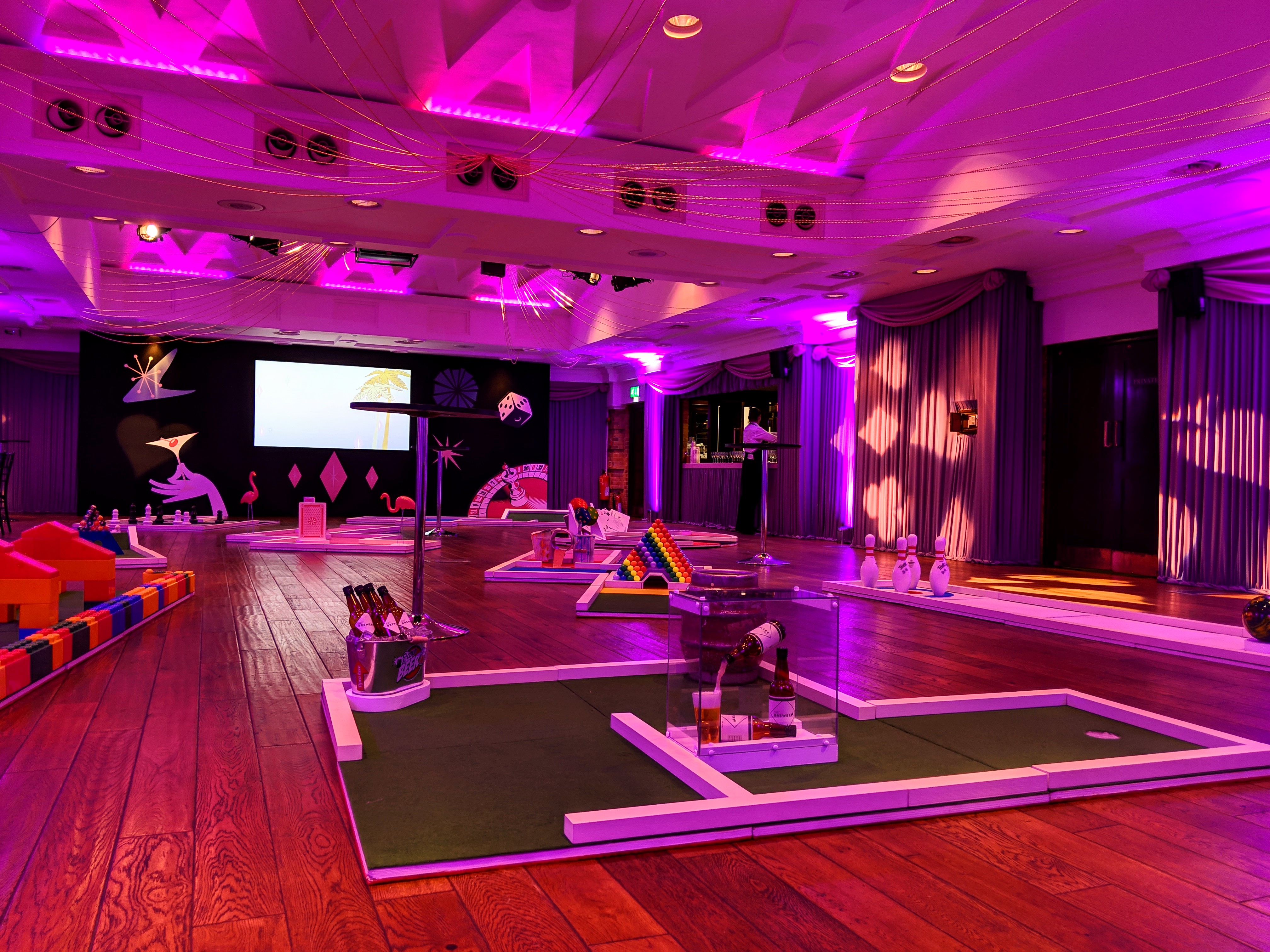 Vibrant event space at The Queen Charlotte with mini-golf for social gatherings.
