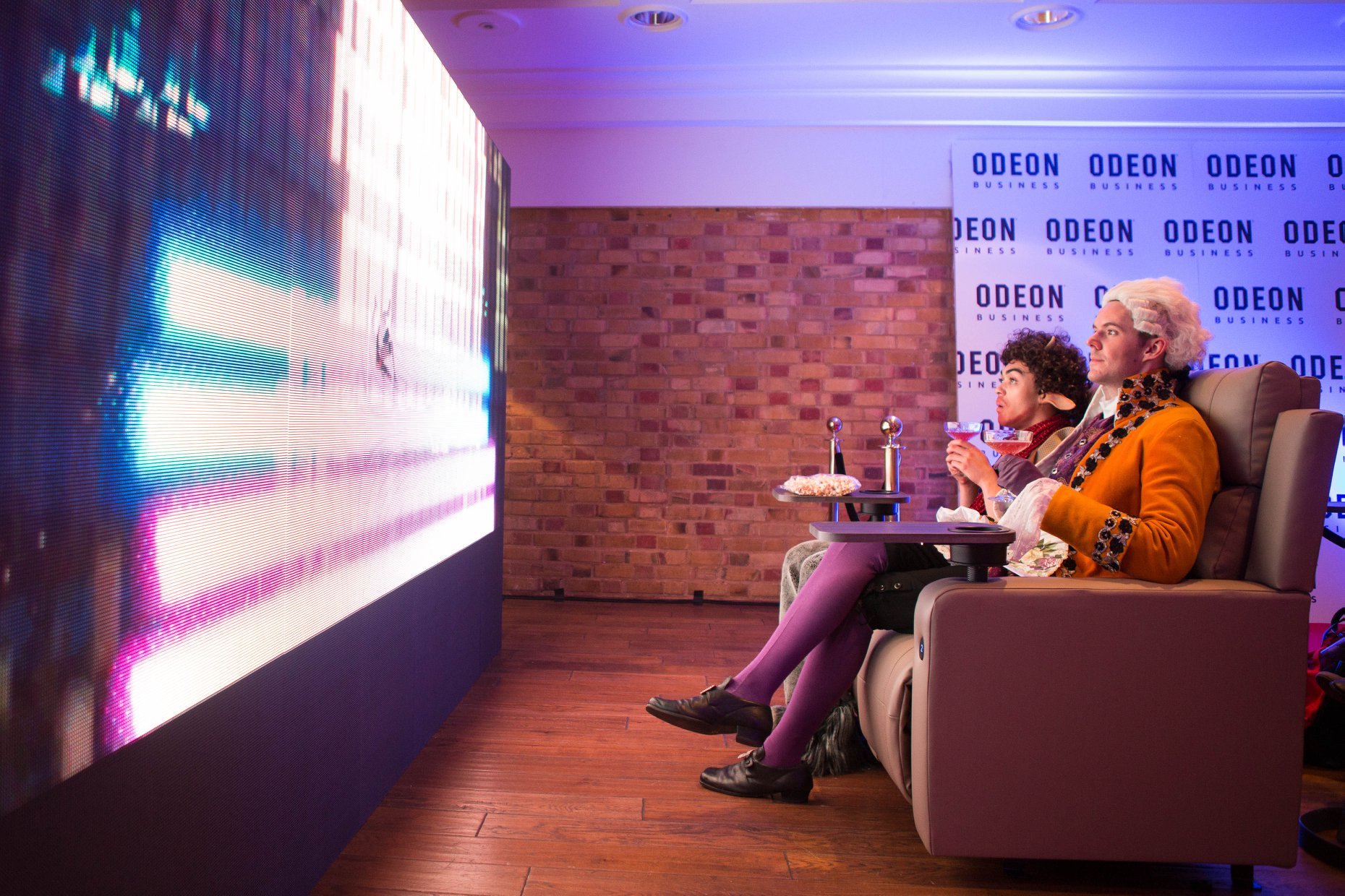 Cozy upscale viewing area at The Queen Charlotte for private screenings and events.