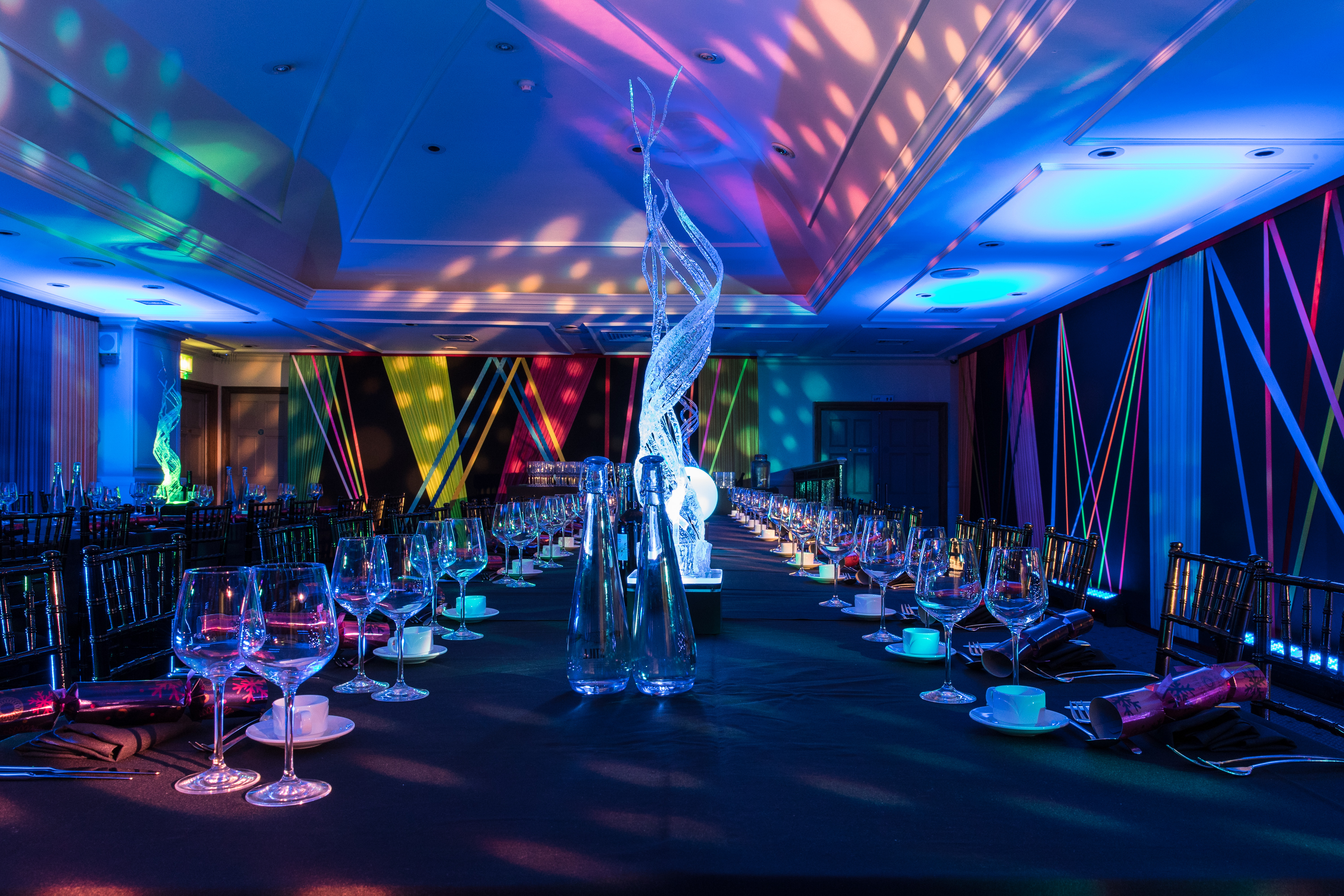 Elegant long table set for formal dinner at The James Watt event space.