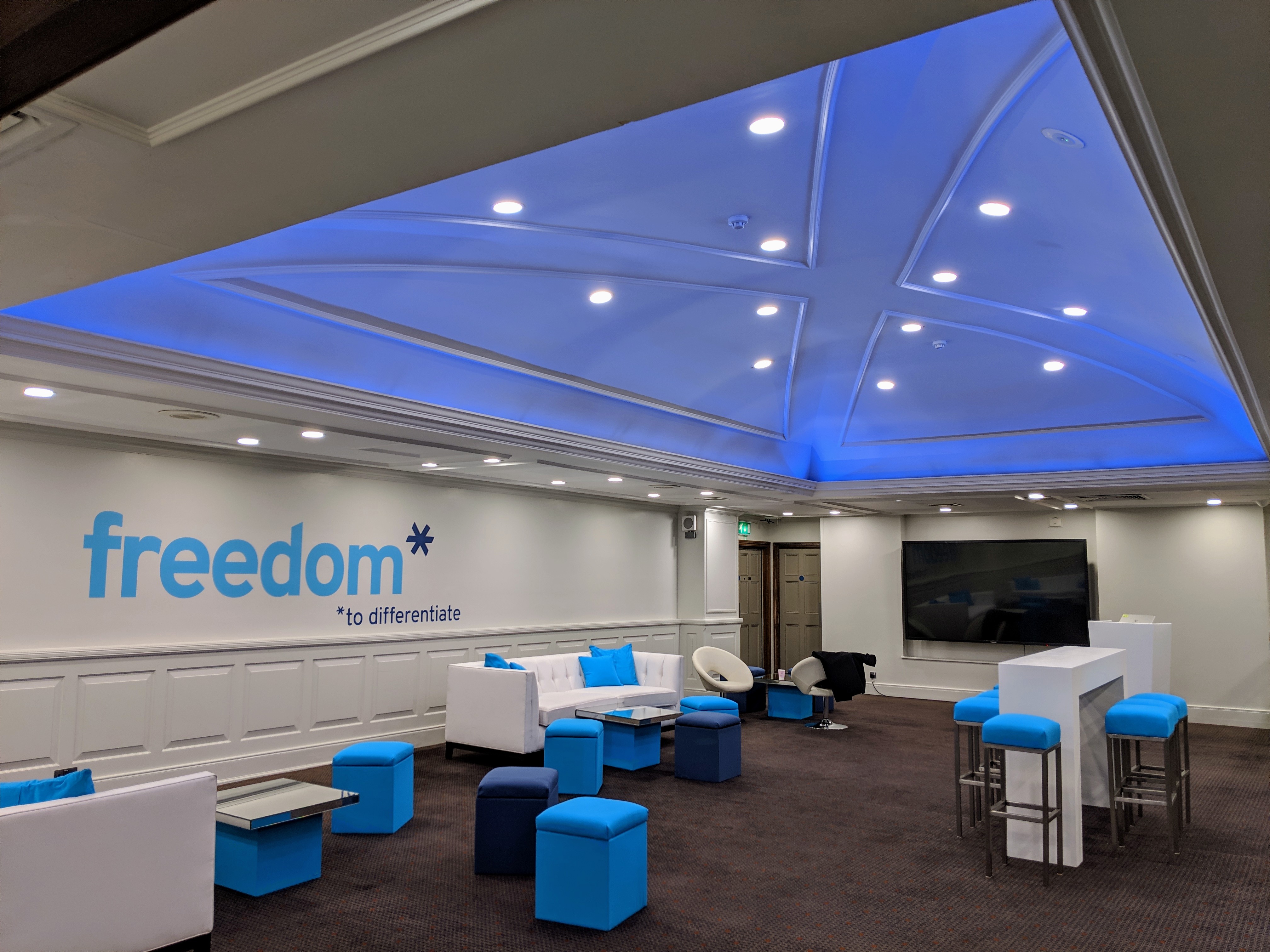 Modern meeting space at The James Watt, featuring sleek furniture and vibrant blue accents.