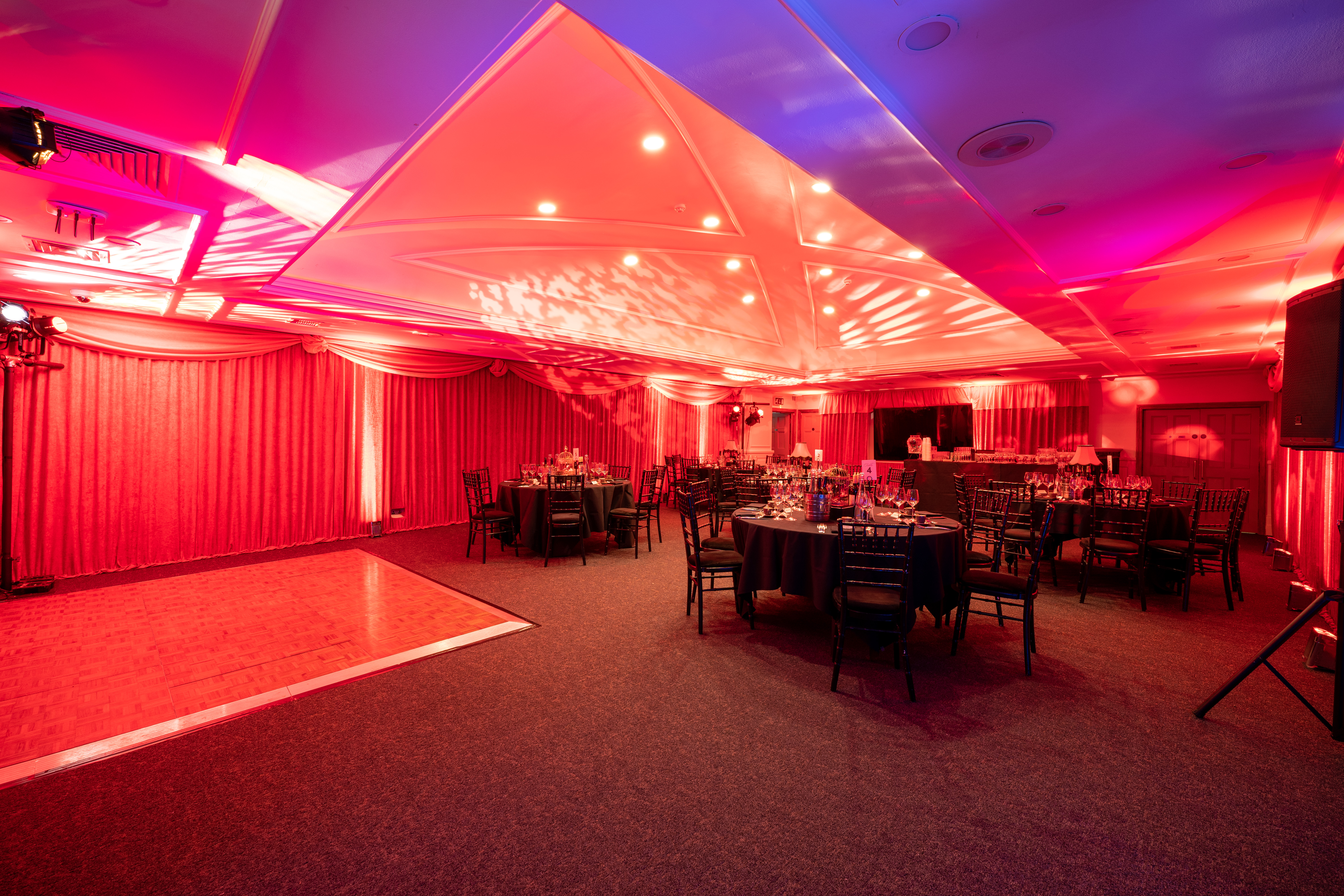 Elegant event space at The James Watt with round tables and dance floor for weddings.