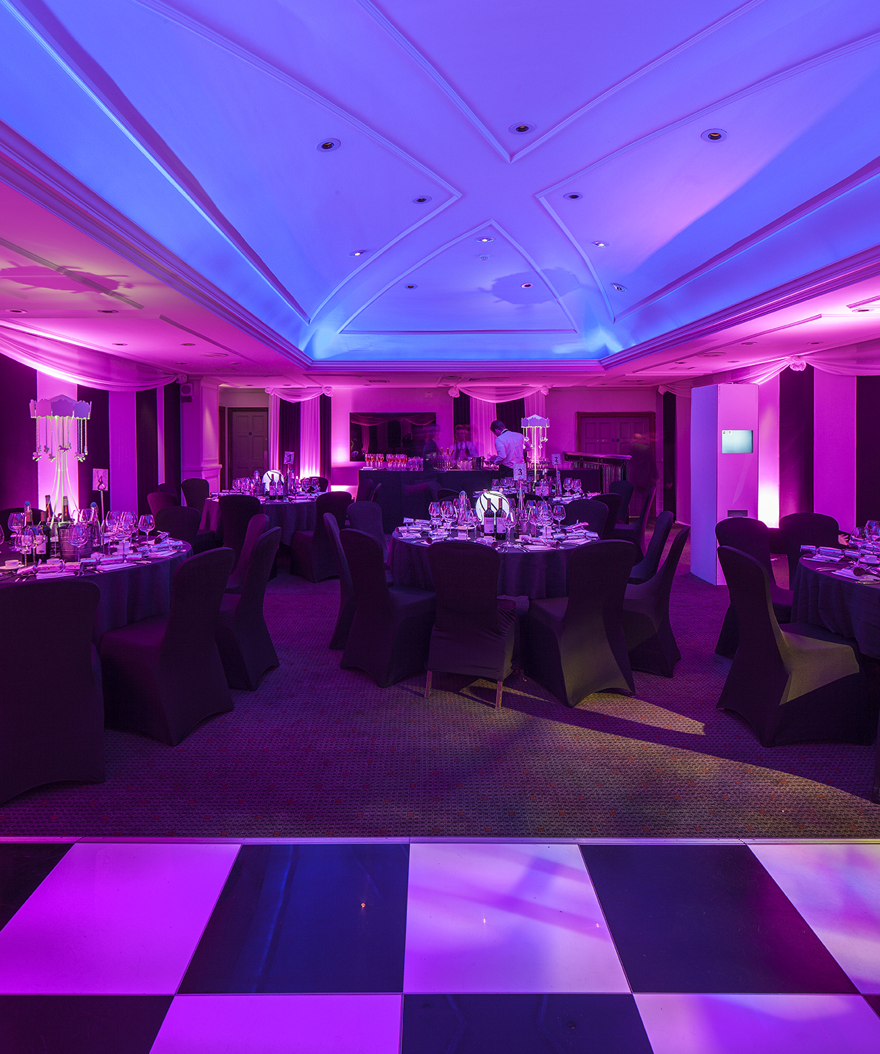 Elegant event space at The James Watt, featuring purple lighting for upscale gatherings.
