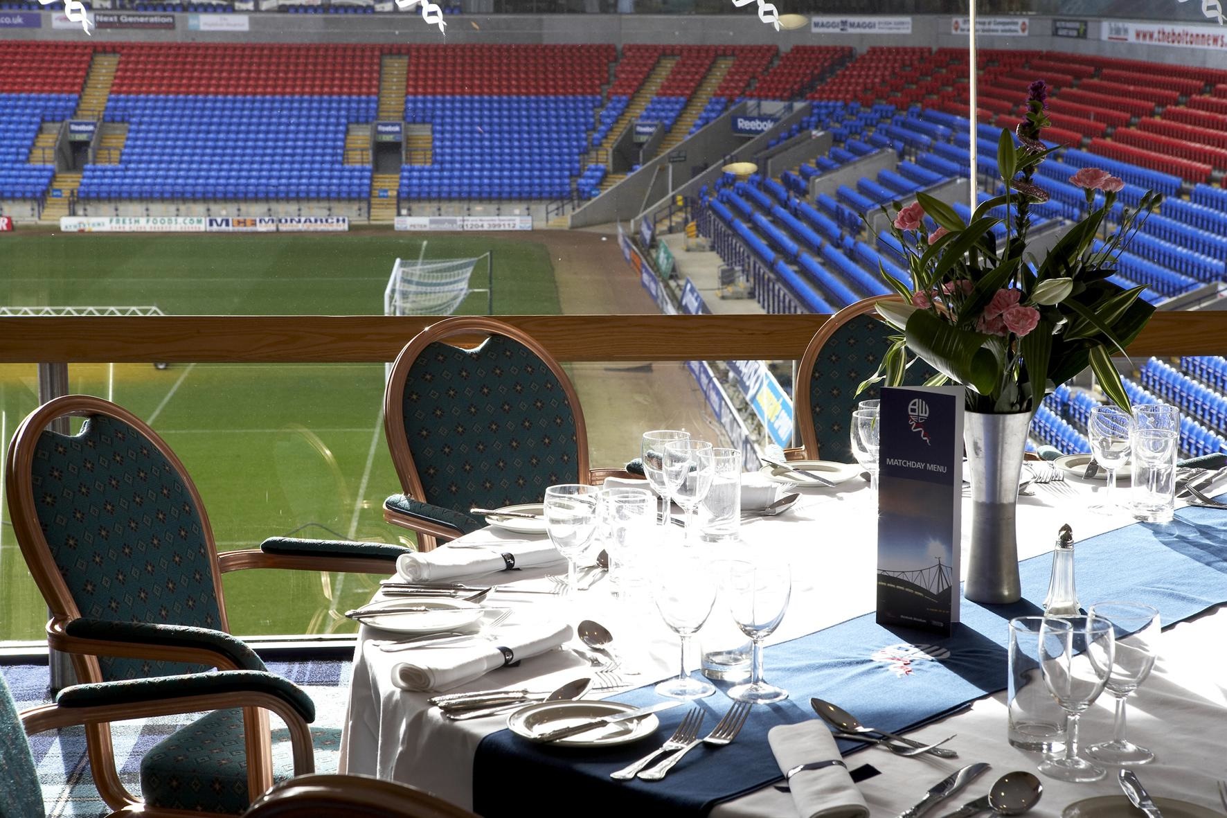 Executive Corner Box at Bolton Whites Hotel with elegant dining setup for corporate events.