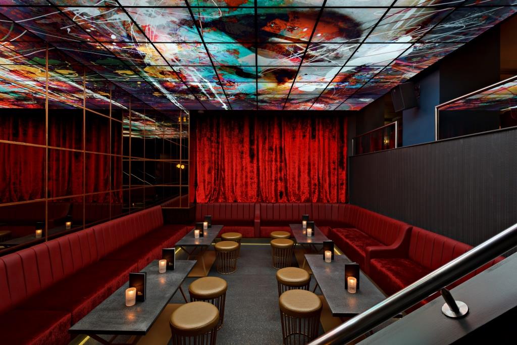 Stylish event space at Dirty Martini St Paul's with vibrant ceiling art, ideal for networking.