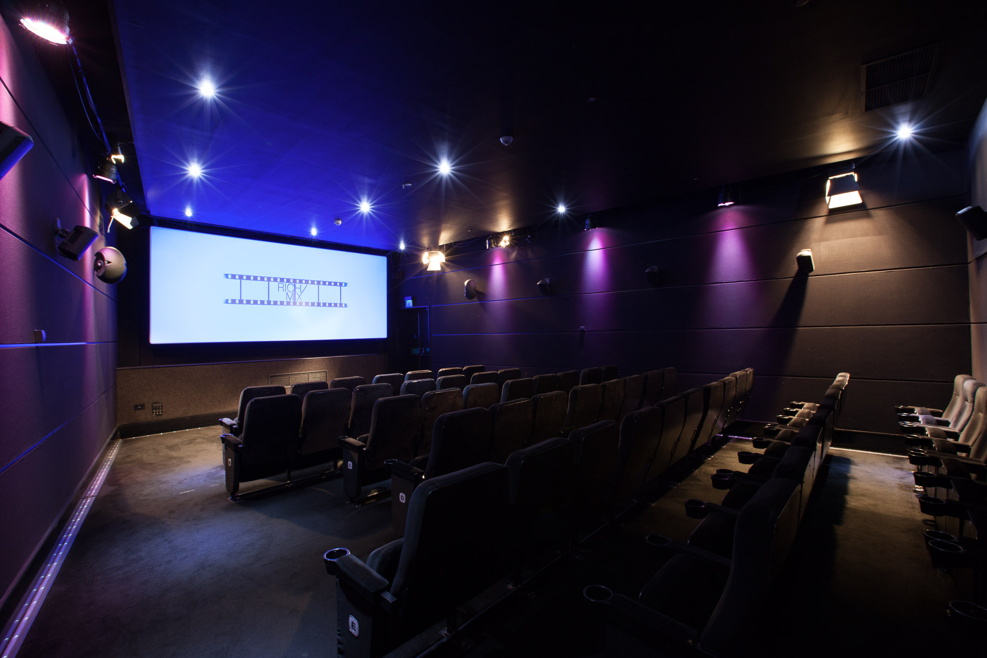 Modern screening room with sleek seating, ideal for private film events and corporate meetings.