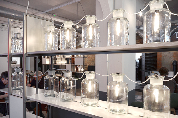 Creative glass jar lighting installation for modern networking events and gatherings.