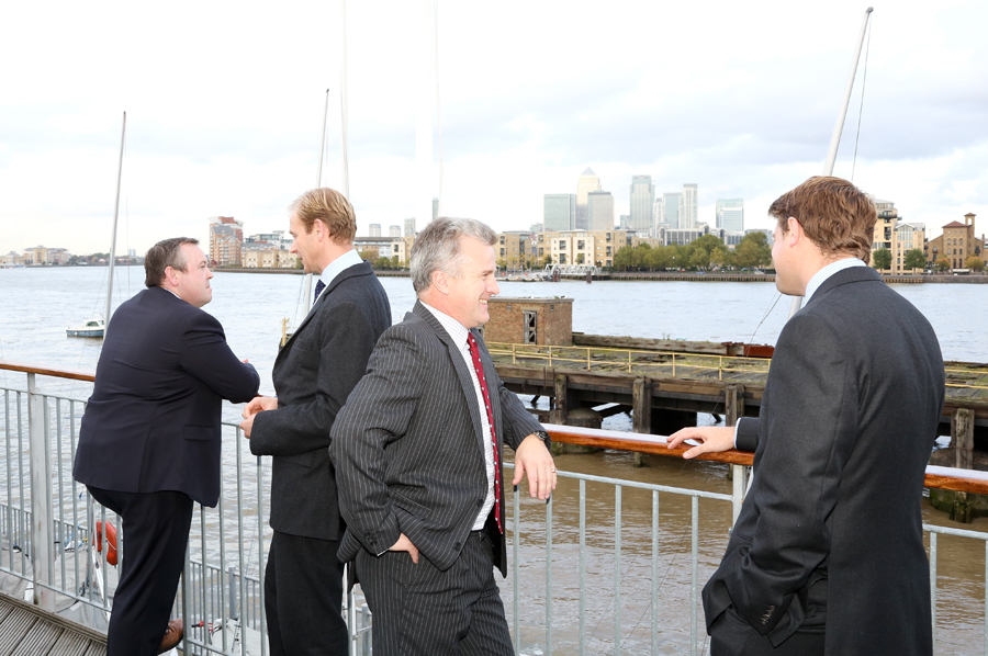 Professionals networking by waterfront at Sir William Boreman Hall, ideal for corporate events.