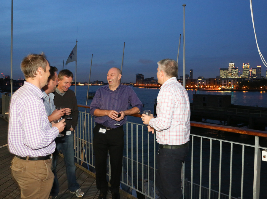 Networking event at Sir William Boreman Hall with waterfront view and city skyline.