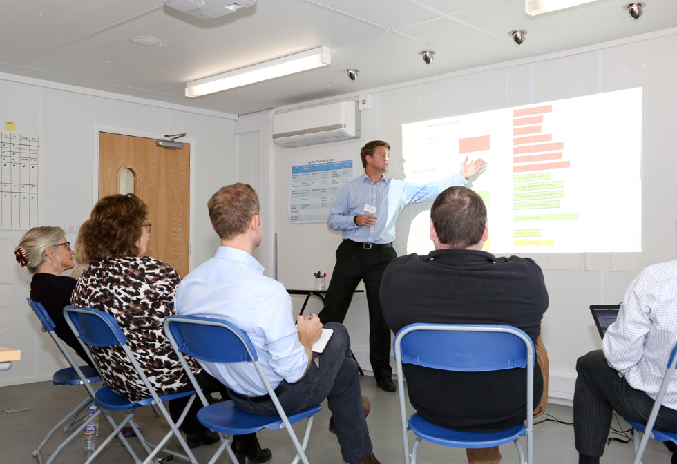 Seminar room at The AHOY Centre with presenter engaging focused audience in training session.