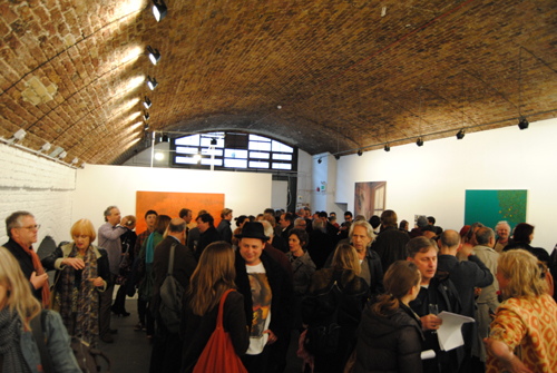 Vibrant networking event under arched brick ceiling at Hoxton Arches gallery.