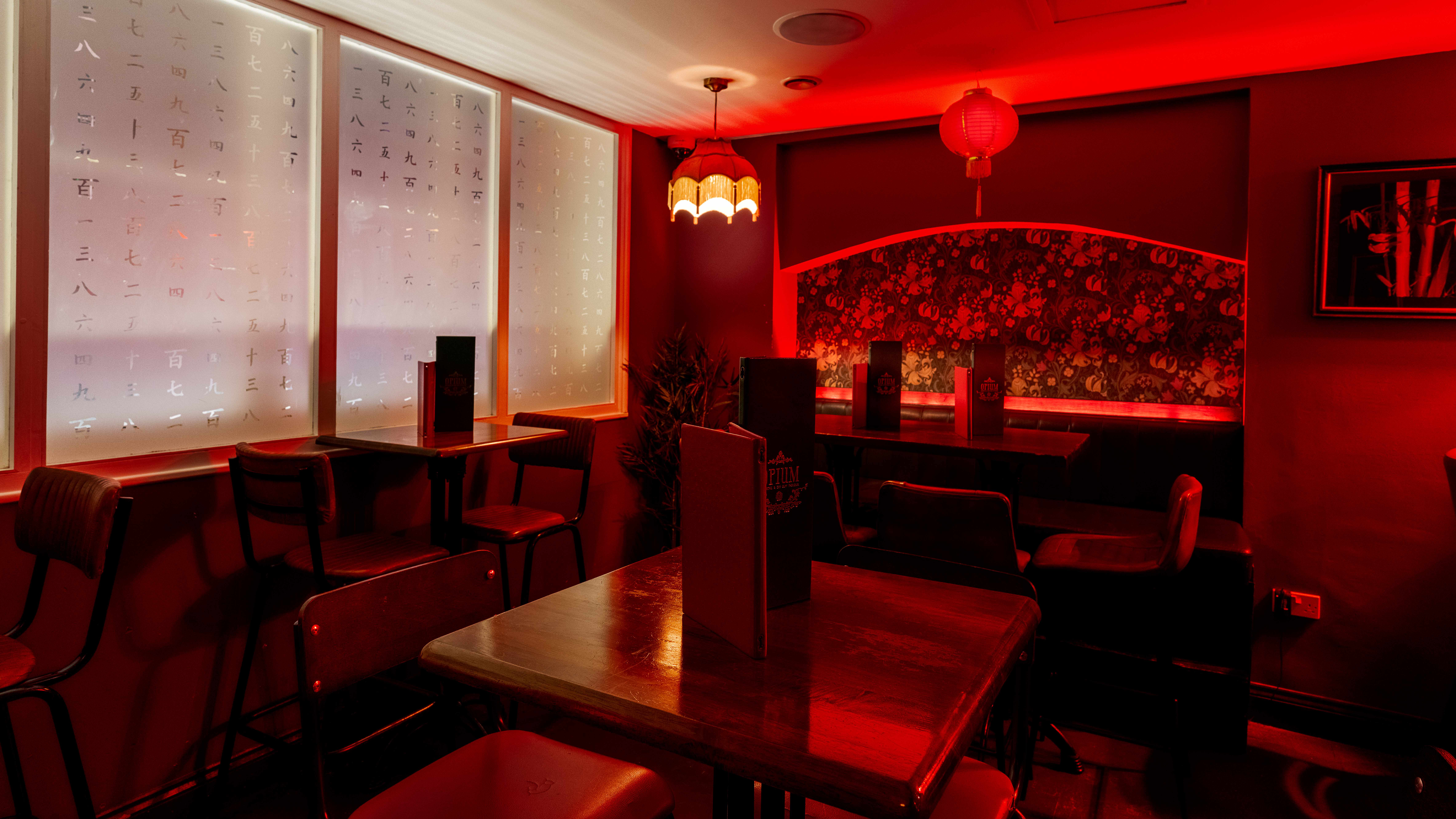 Cozy Apothecary Bar with warm lighting, perfect for private events and gatherings.