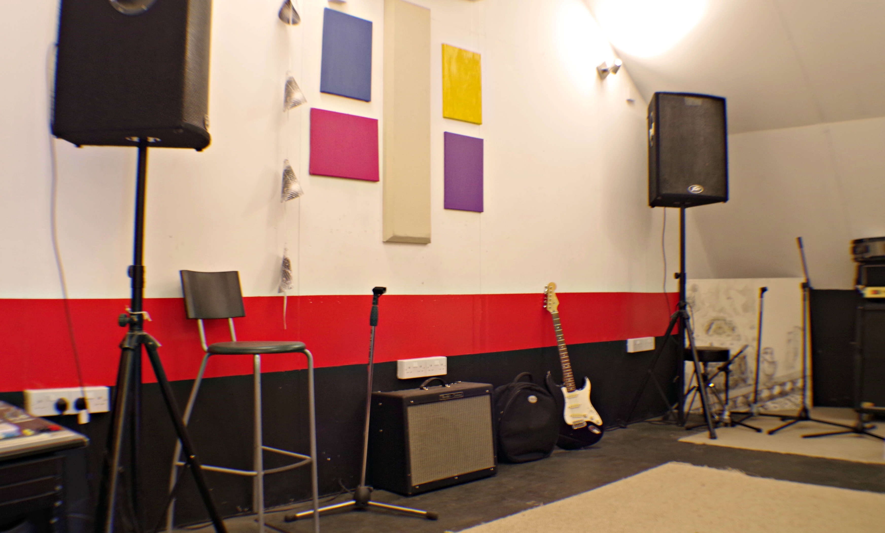Versatile event space in BonaFideStudio with sound equipment for workshops and gatherings.