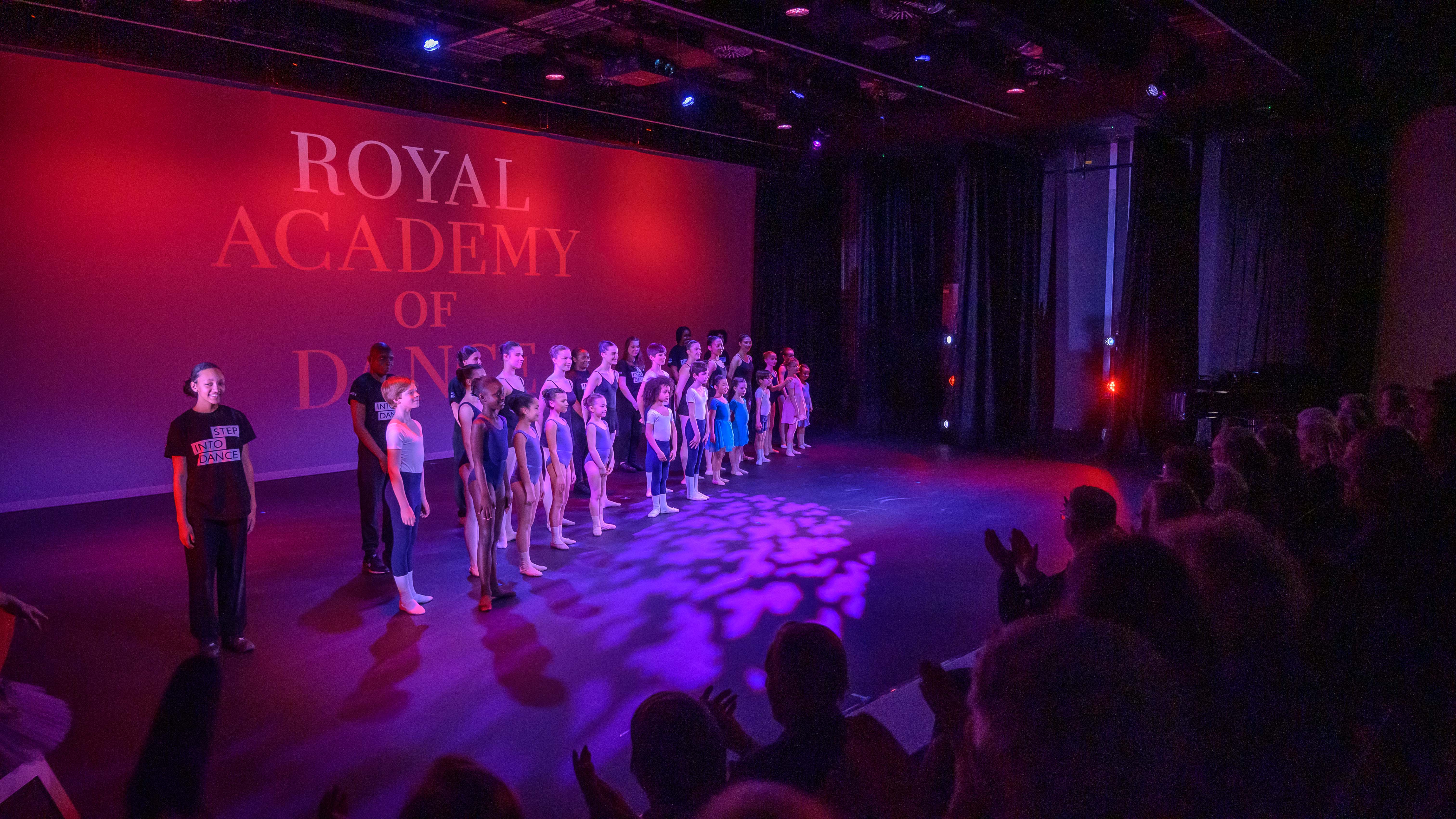 Aud Jebsen Studio Theatre with dancers performing for an engaged audience at a vibrant event.