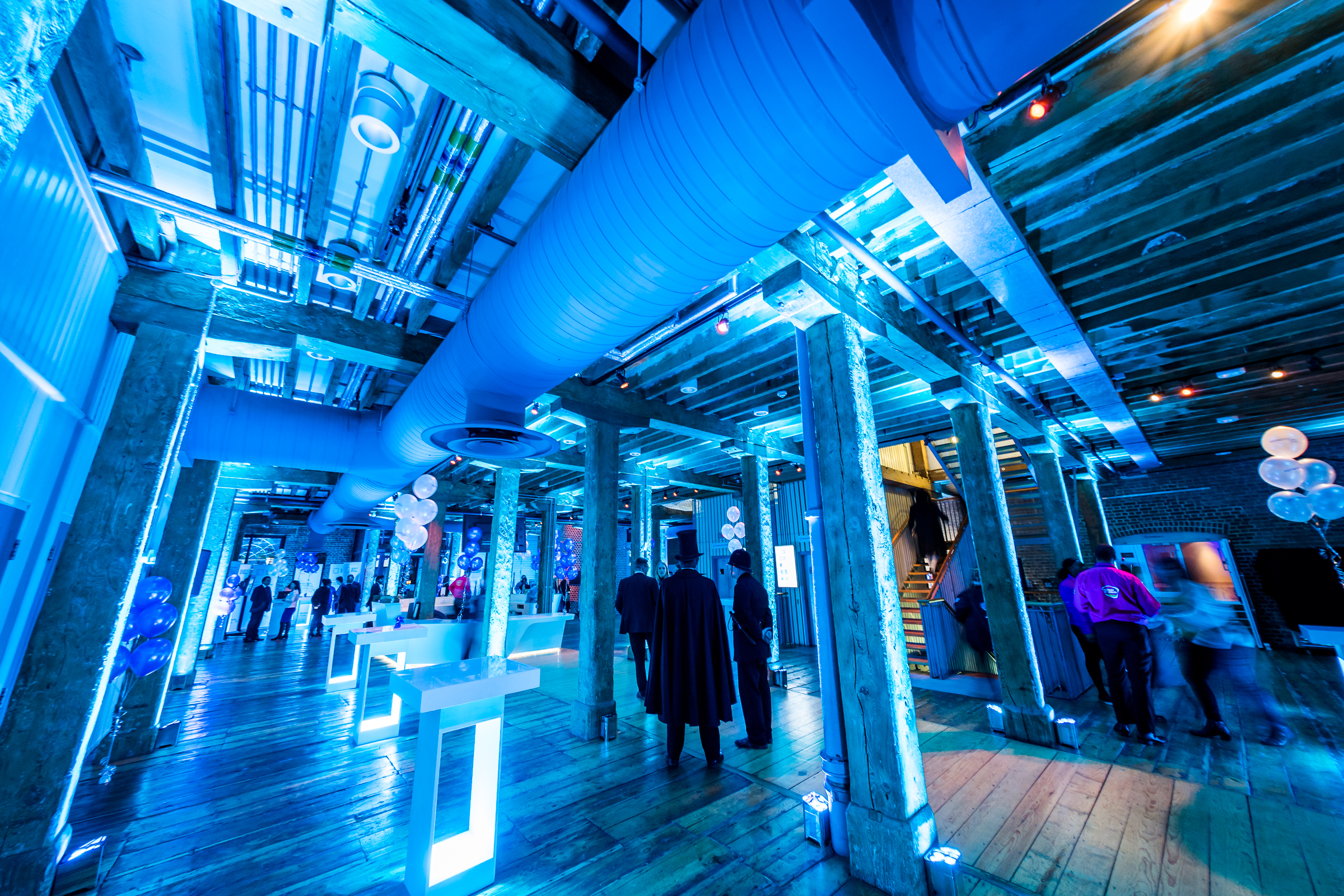 Muscovado Hall at London Museum Docklands, vibrant event space with modern lighting.