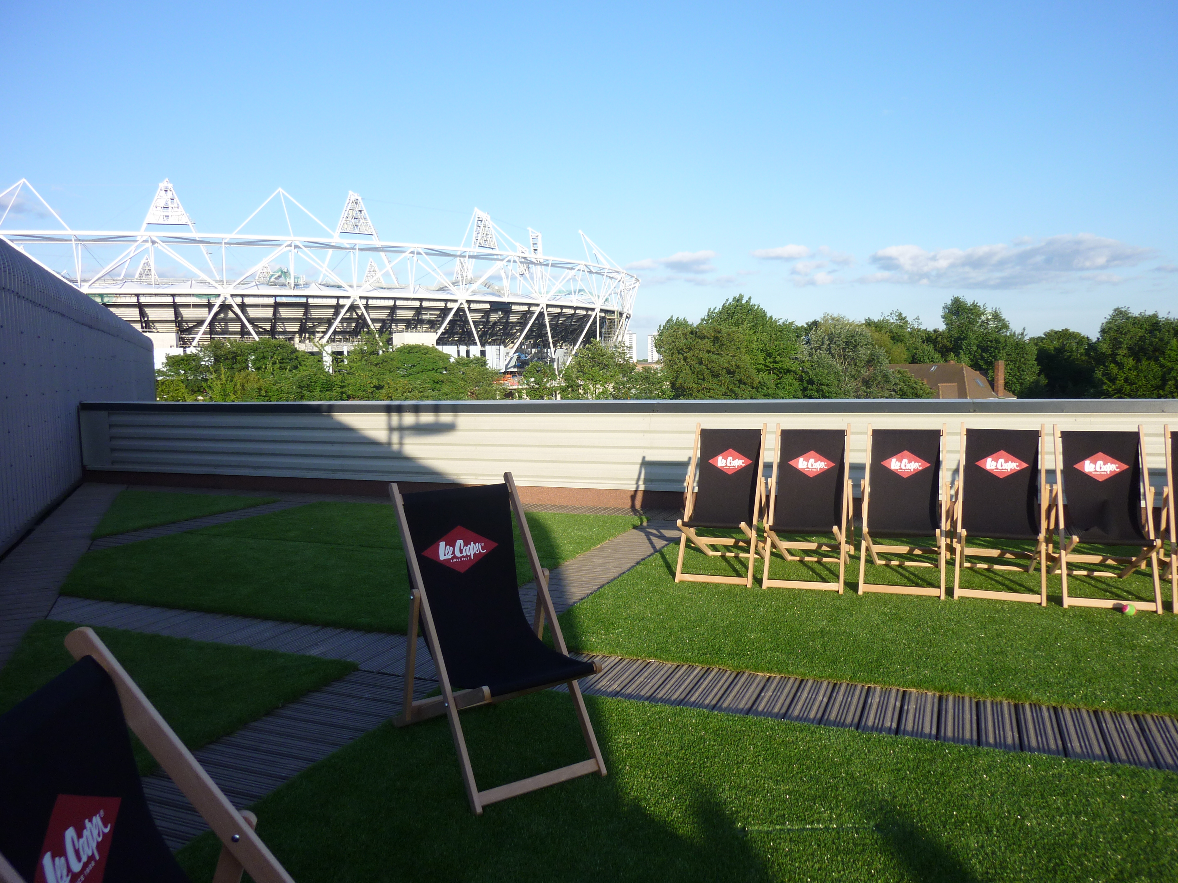 Smokehouse Gallery outdoor event space with deck chairs, ideal for summer gatherings.