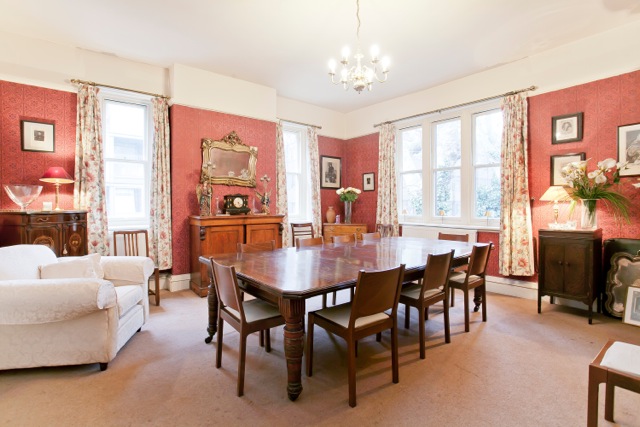 Dining room at St Matthew's Conference Centre with elegant wooden table, ideal for workshops.
