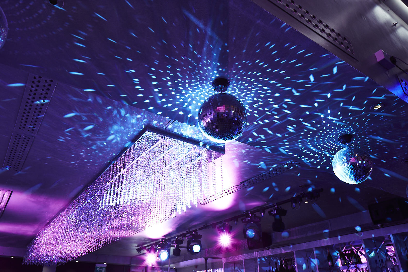 Vibrant event space with disco balls for lively parties and celebrations in Aquum.