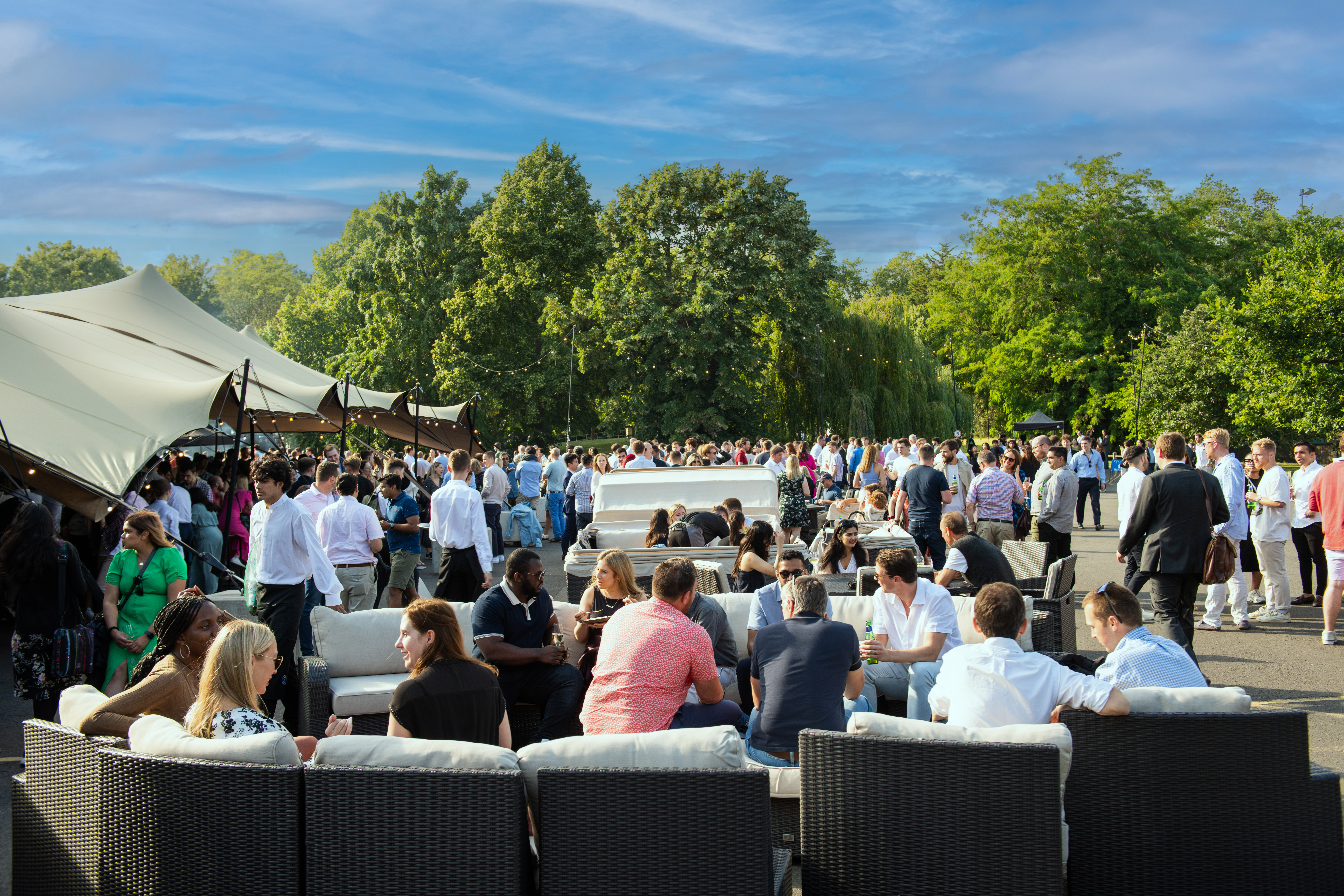 Vibrant outdoor event at Evolution London with lounge seating for networking and collaboration.