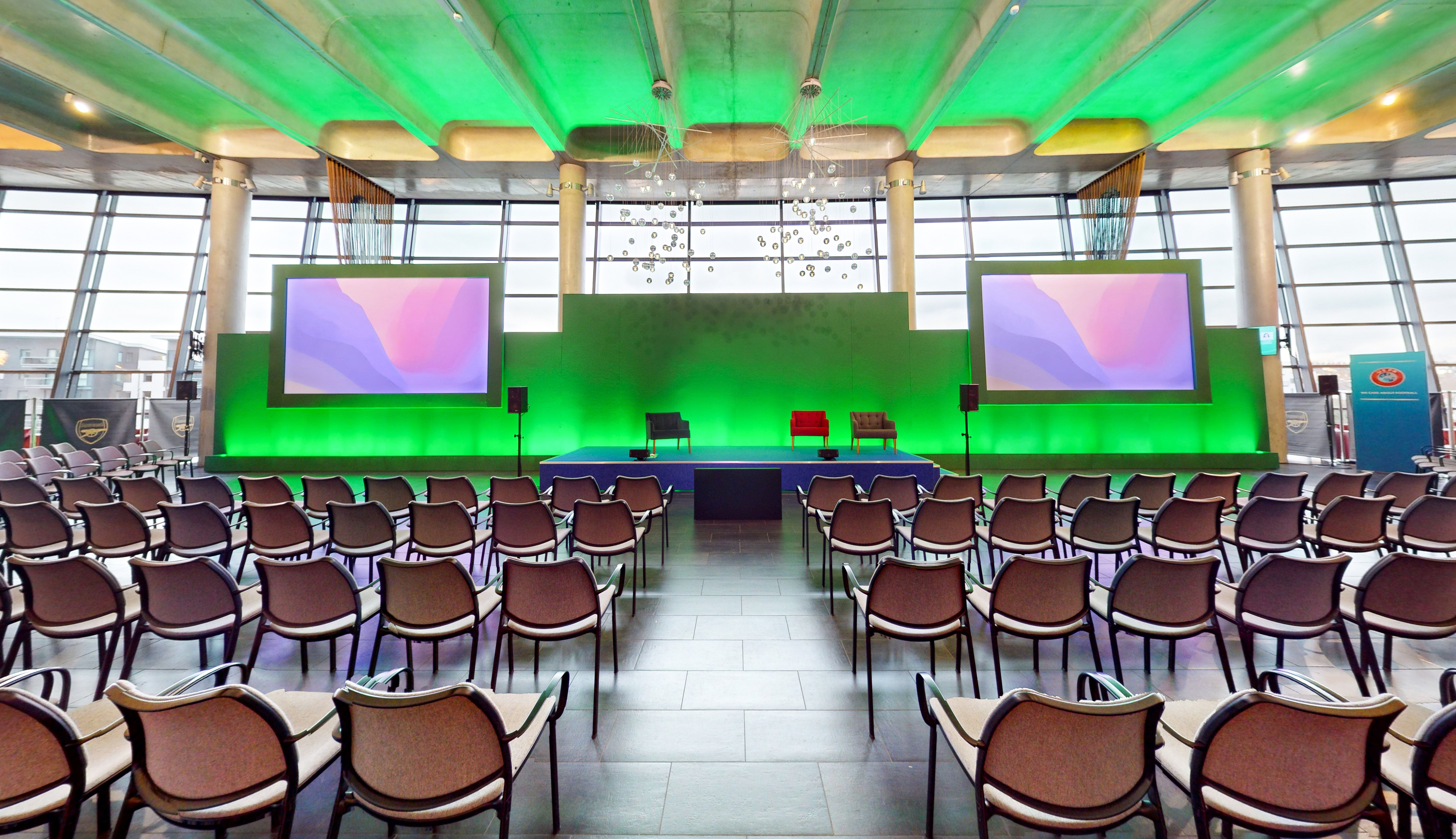 Emirates Stadium event space with modern stage, ideal for conferences and panel discussions.