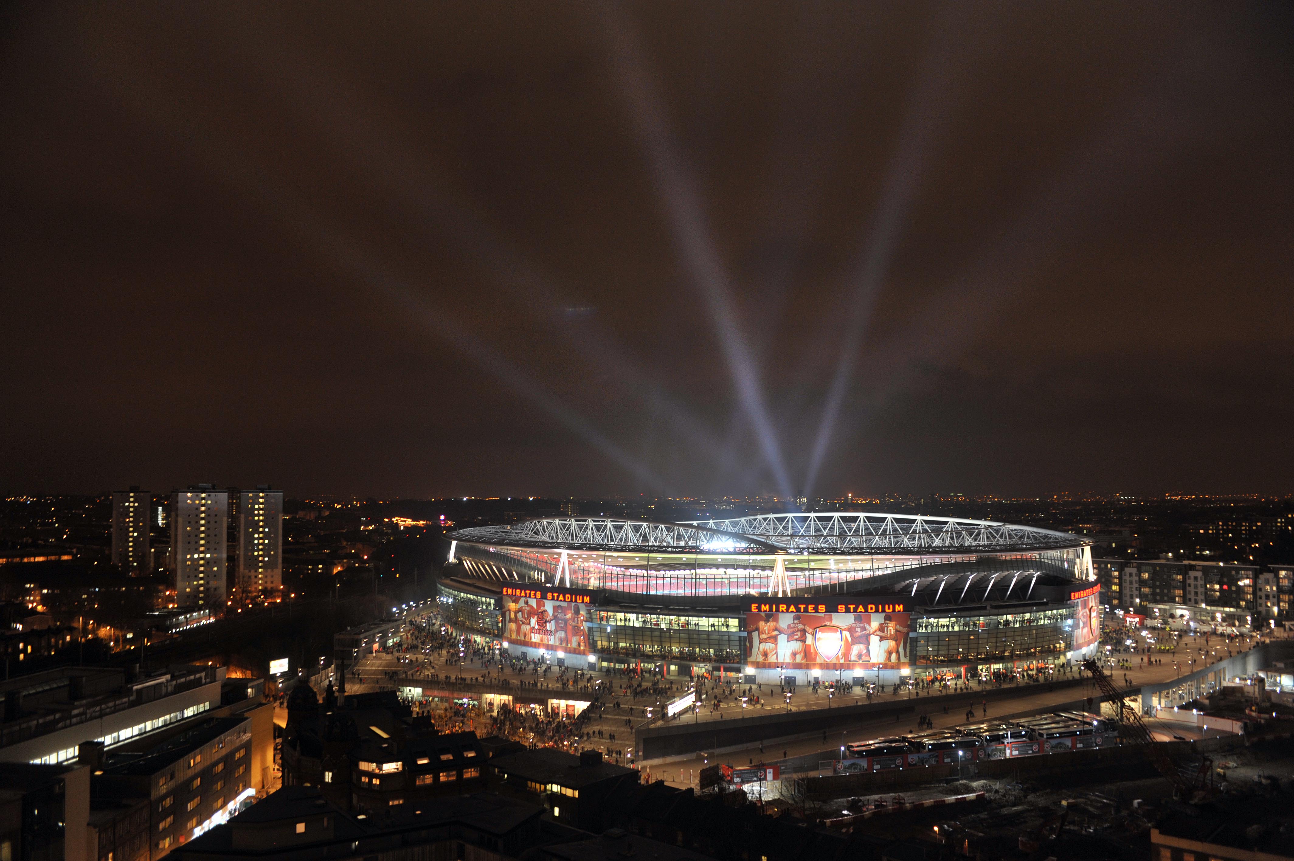 Emirates Stadium at night, vibrant venue for sports and events in Woolwich.